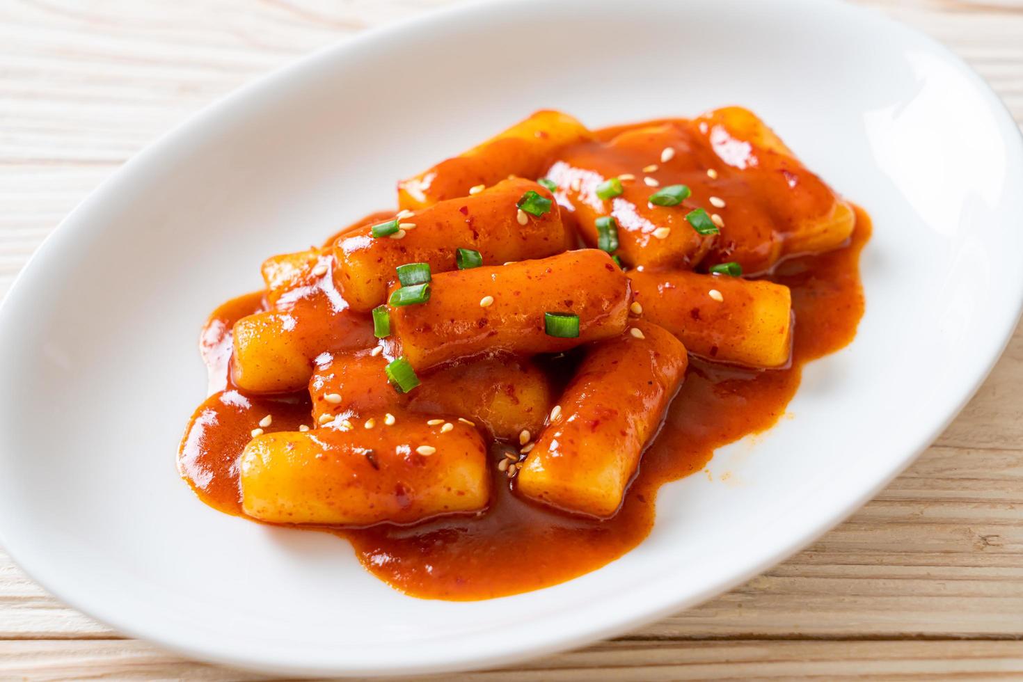 Korean rice cake stick in spicy sauce - Tteokbokki photo