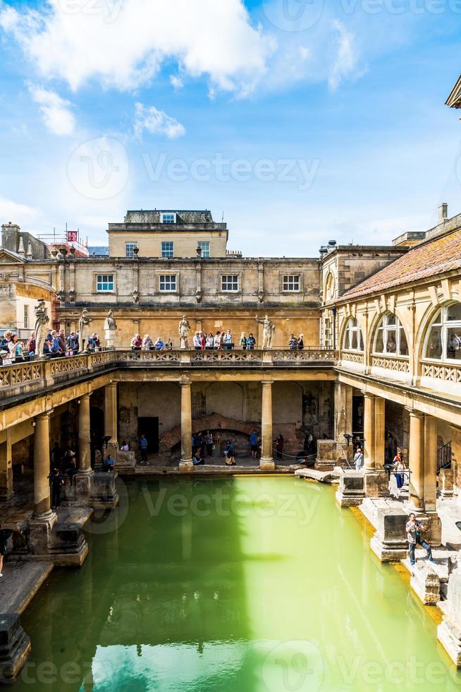 BATH, ENGLAND - AUG 30, 2019 - Roman Baths, the UNESCO World Heritage site with people, which is a site of historical interest in the city of Bath. photo
