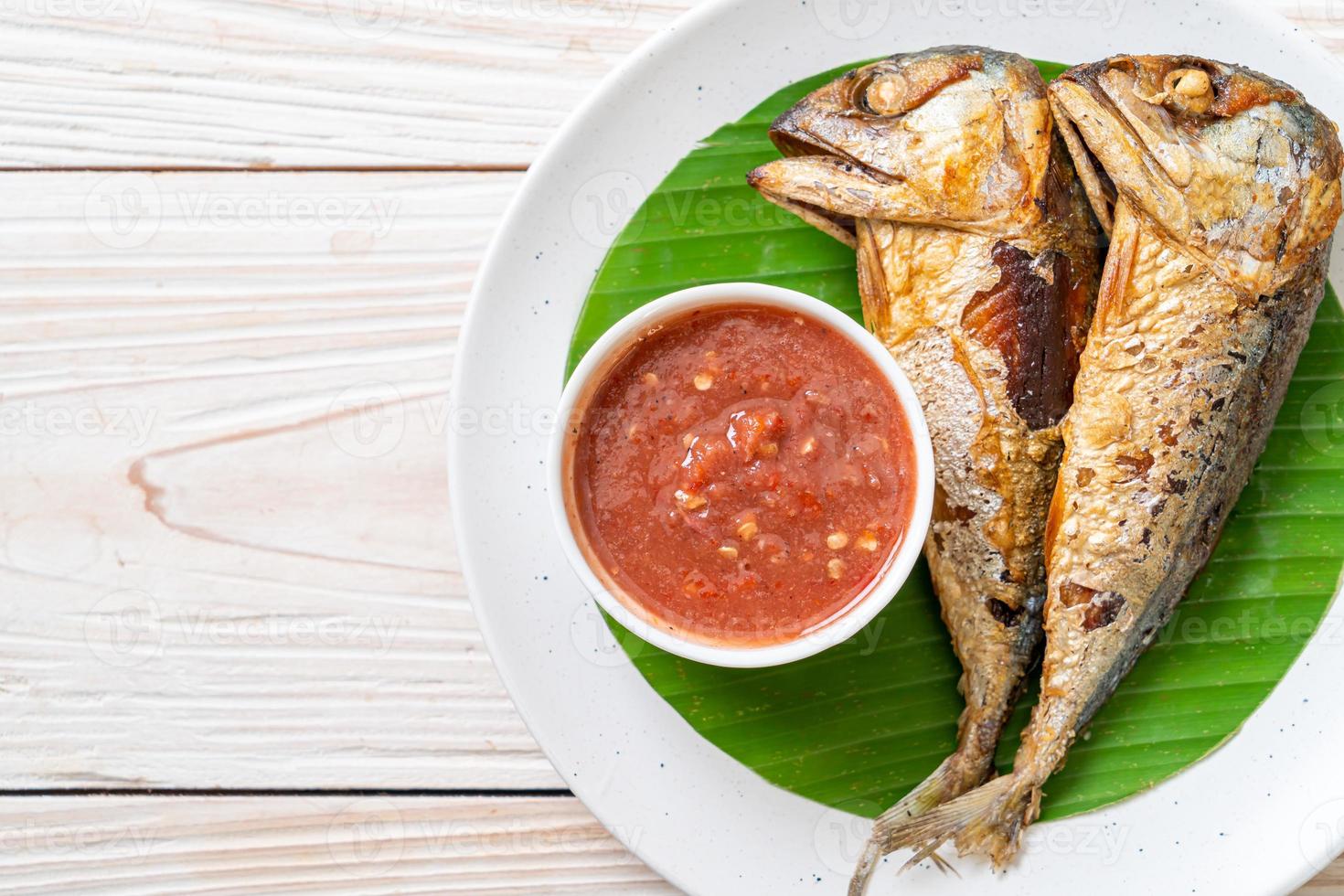 Fried mackerel fish with spicy shrimp paste sauce photo