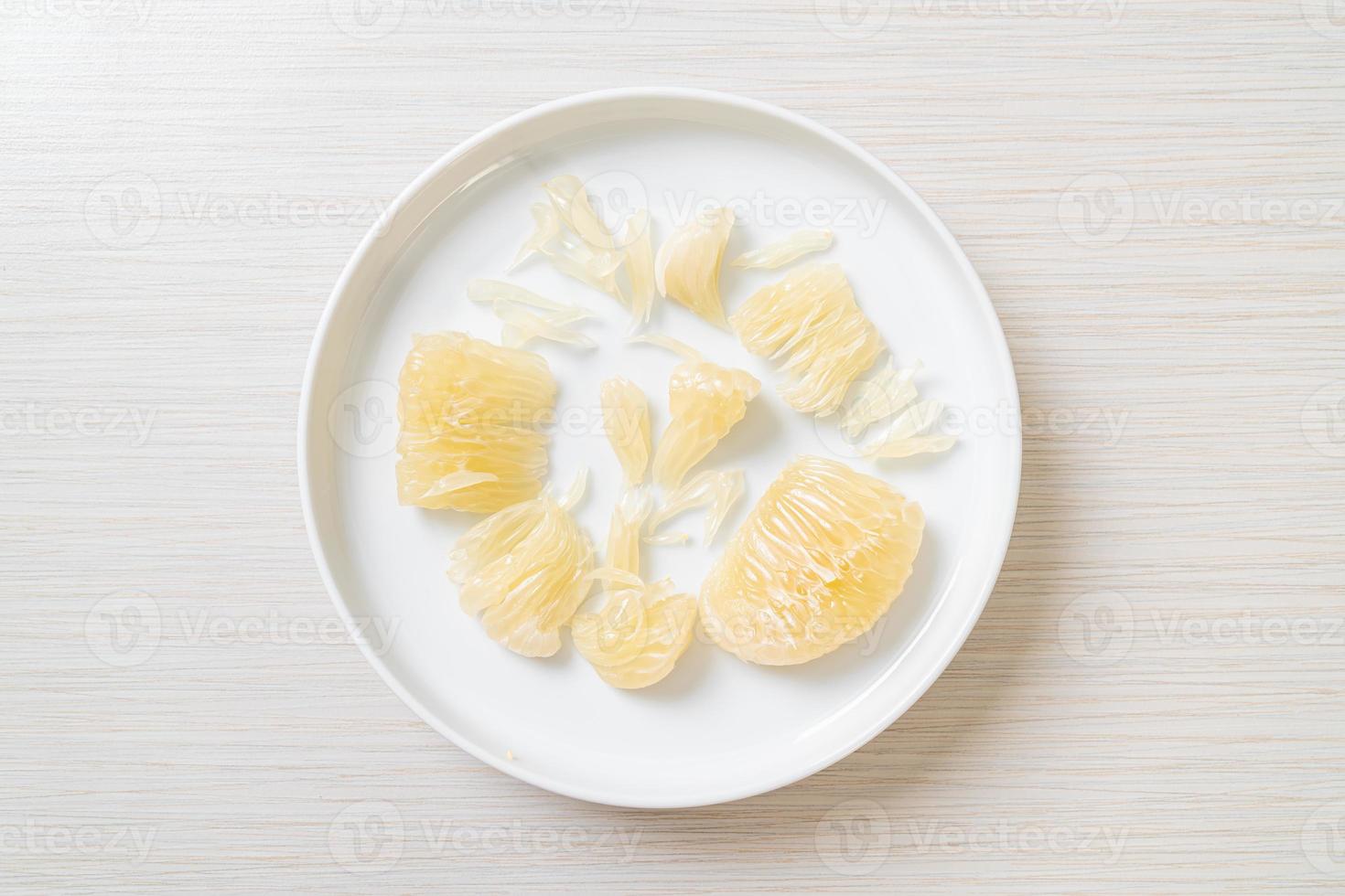 Fresh peeled pomelo, grapefruit or shaddock photo