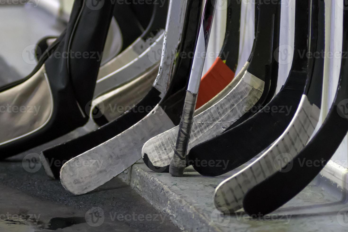 Hockey sticks near the locker room before the game photo