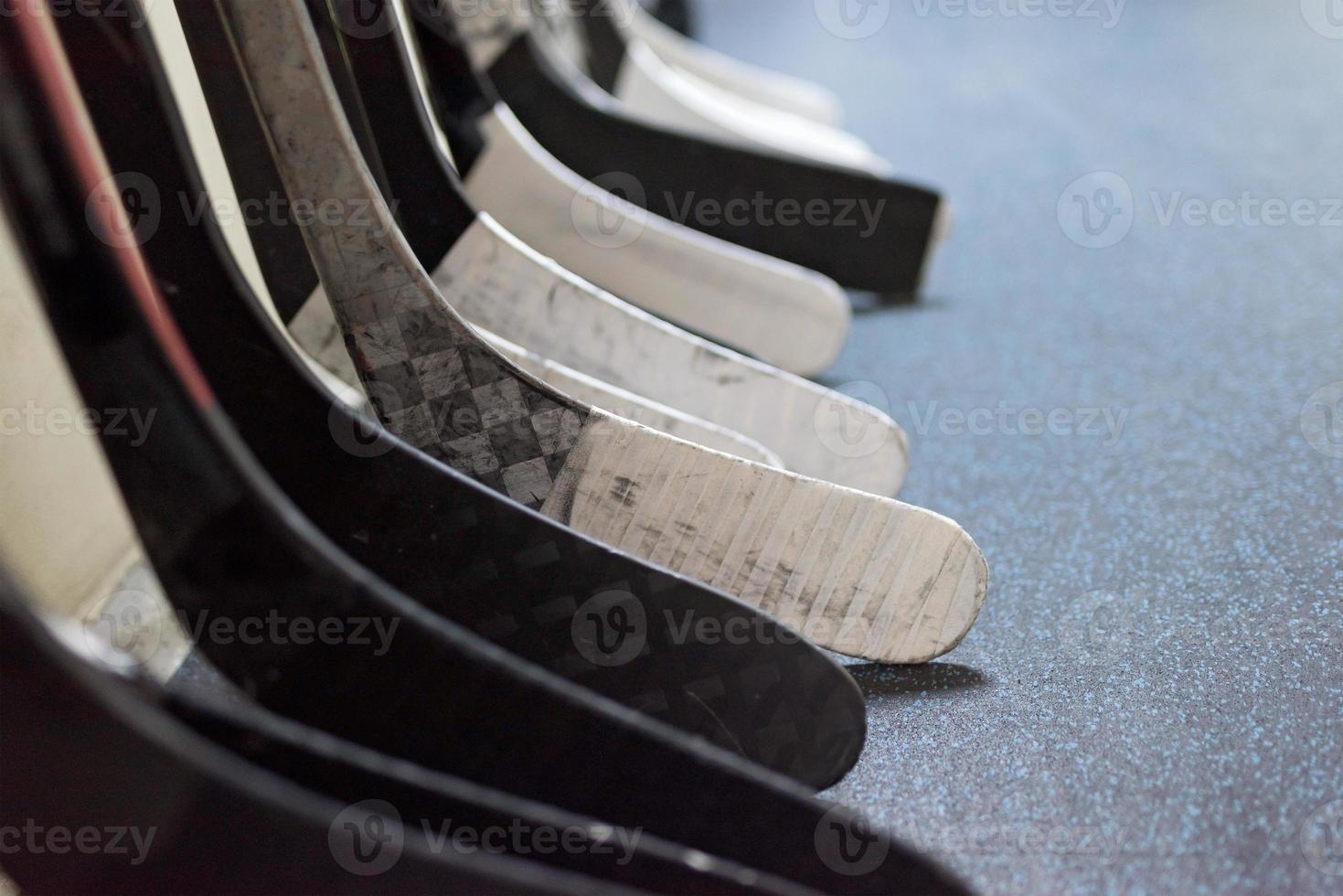 Hockey sticks near the locker room before the game photo