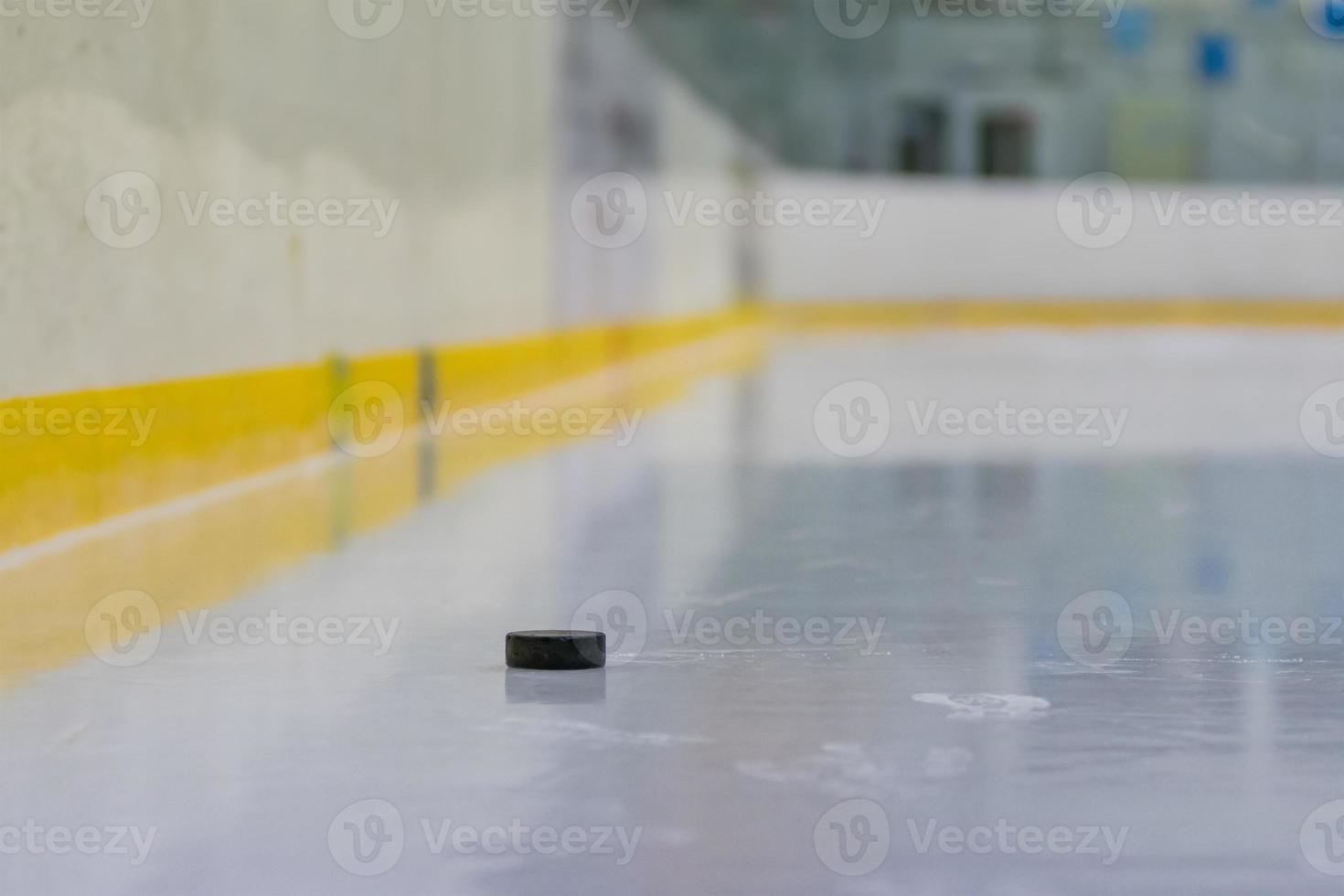 Hockey puck on the ice photo