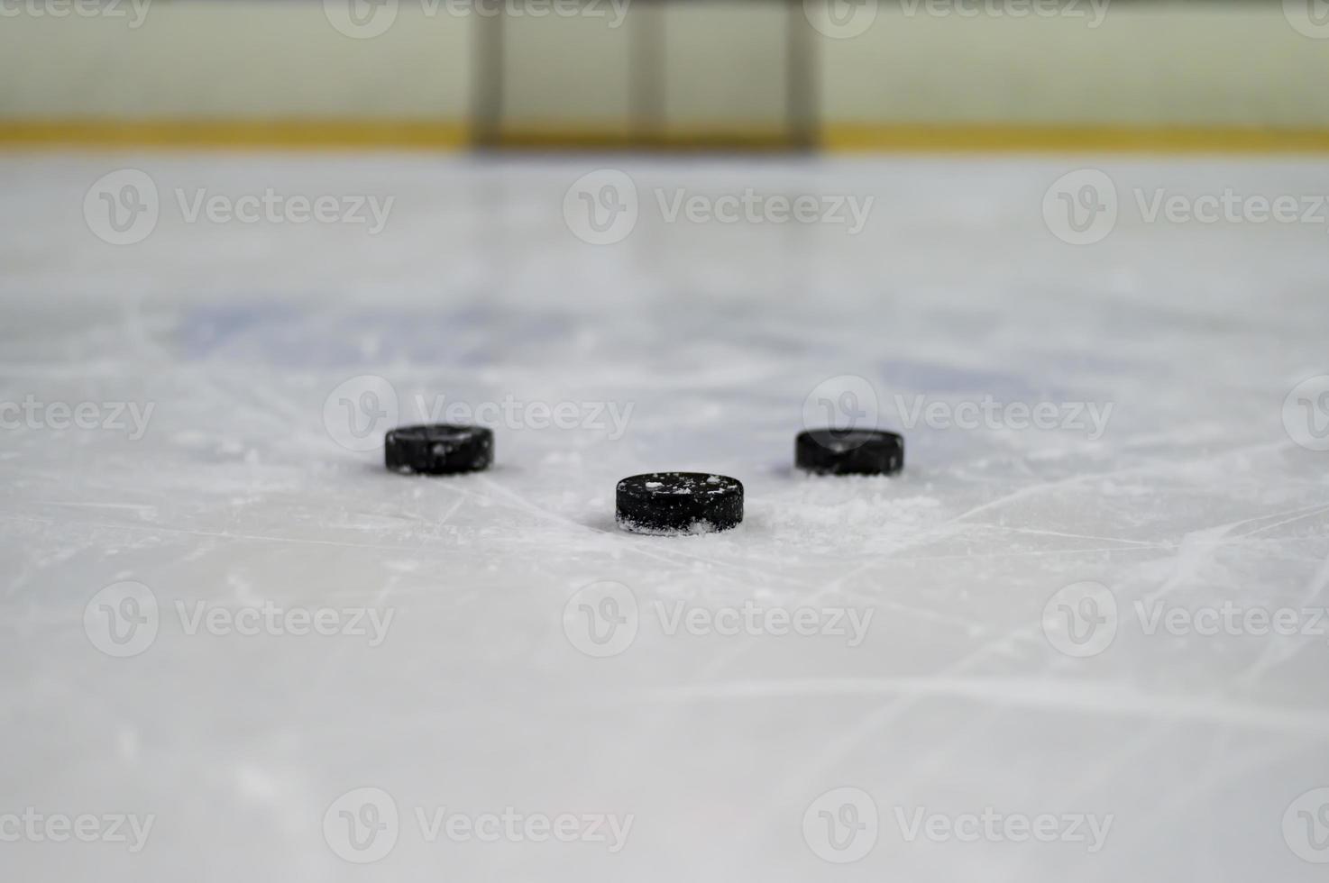 Hockey puck on the ice photo