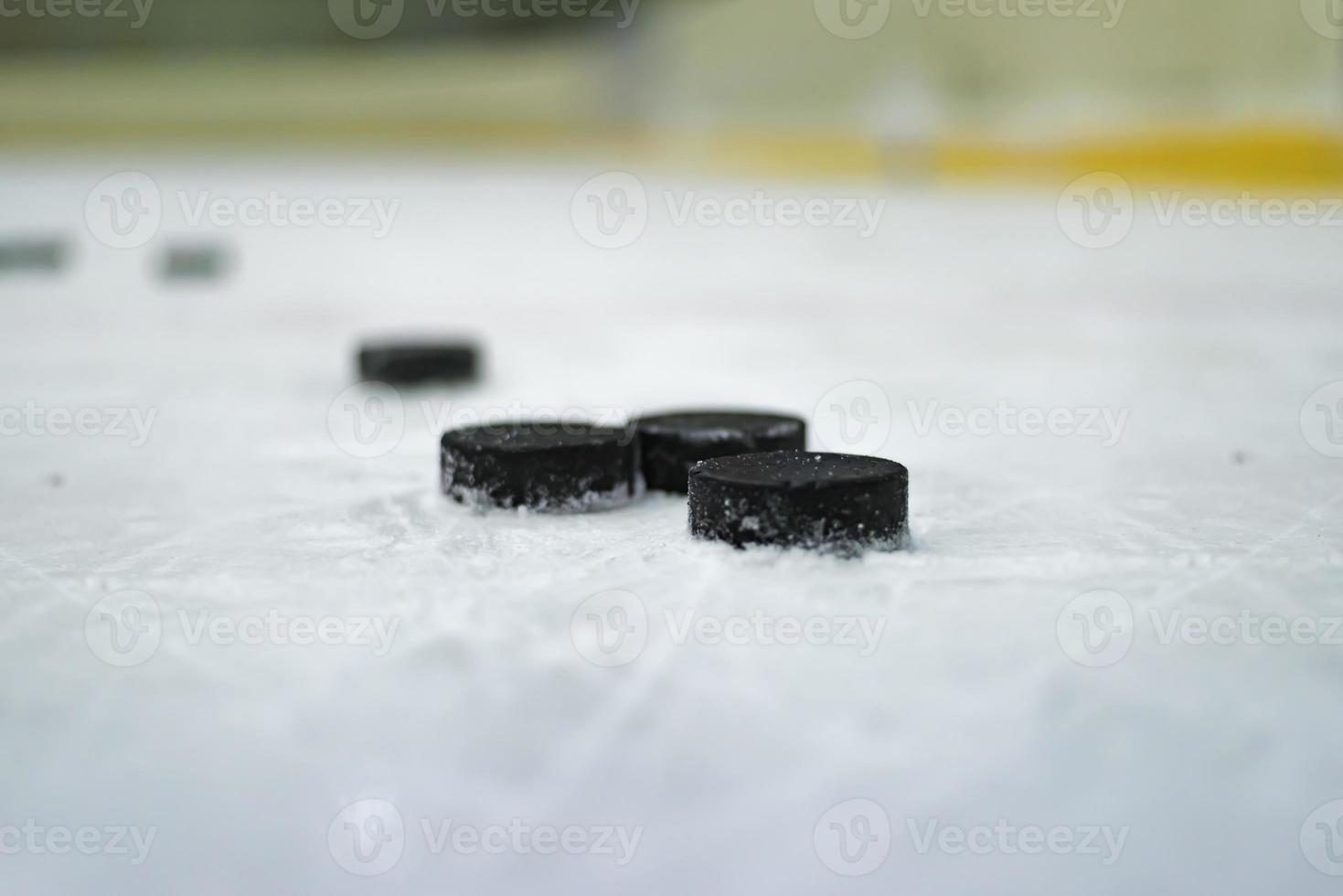 Hockey puck on the ice photo