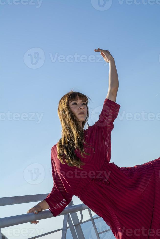 long haired girl dancing outdoors photo