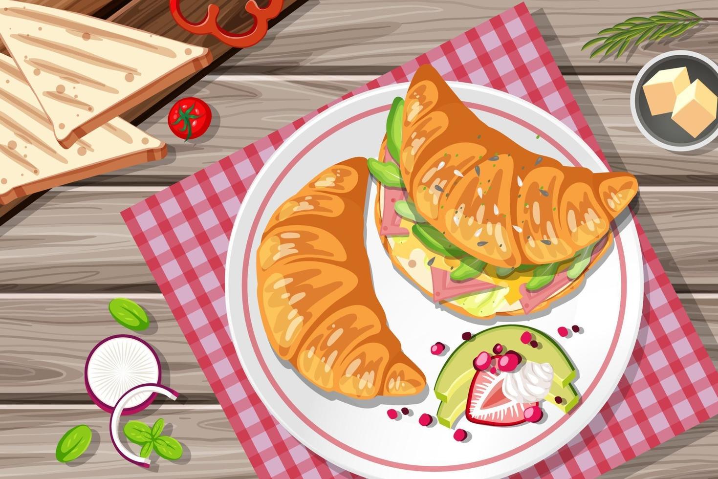 Sándwich de croissant de desayuno con verduras y huevo en la mesa vector