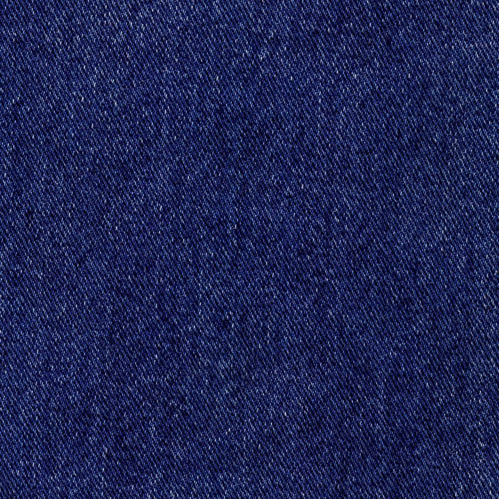 Blue denim square, background of textured jeans material photo