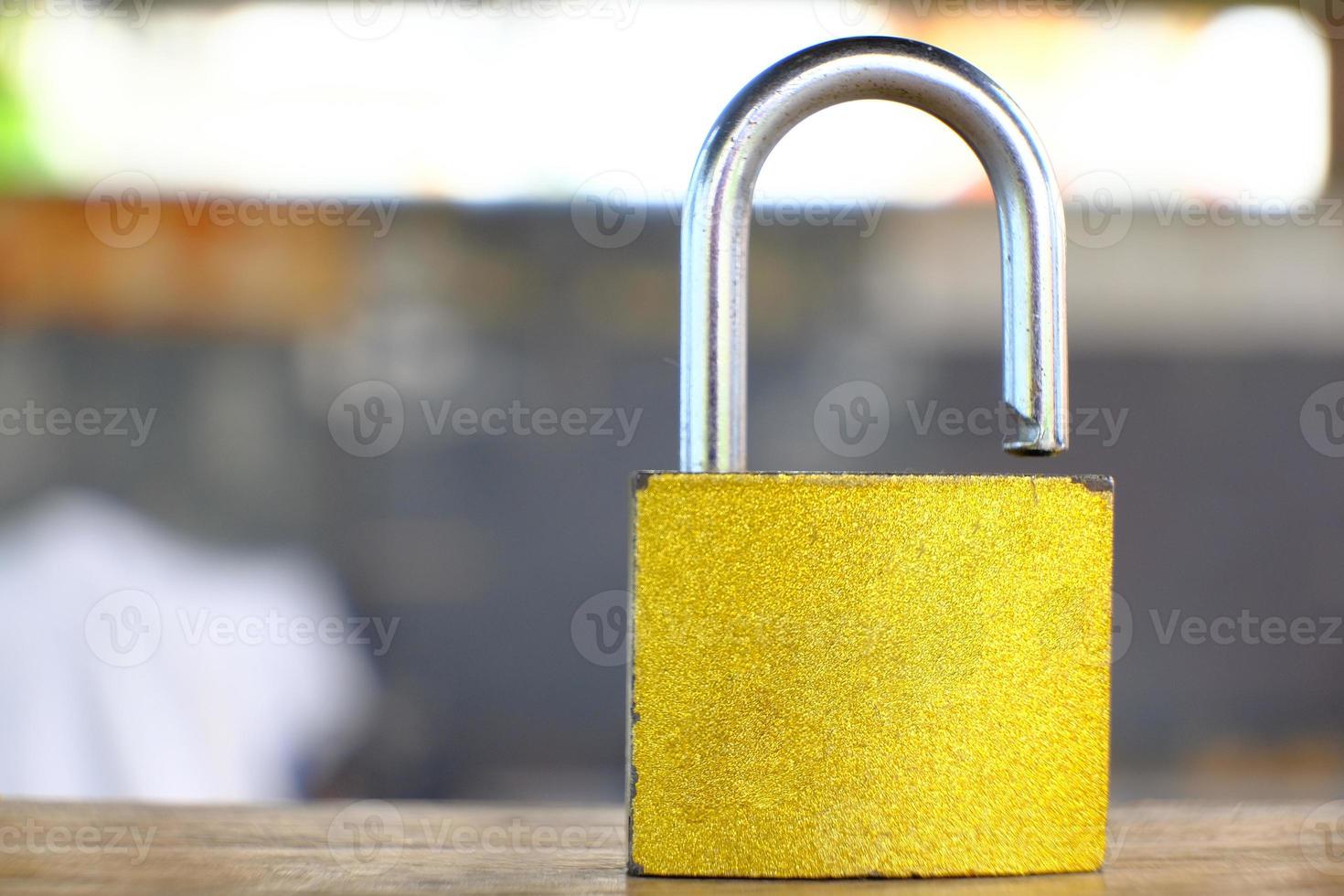 Padlock on table background and business security concept, protecting data personal information photo