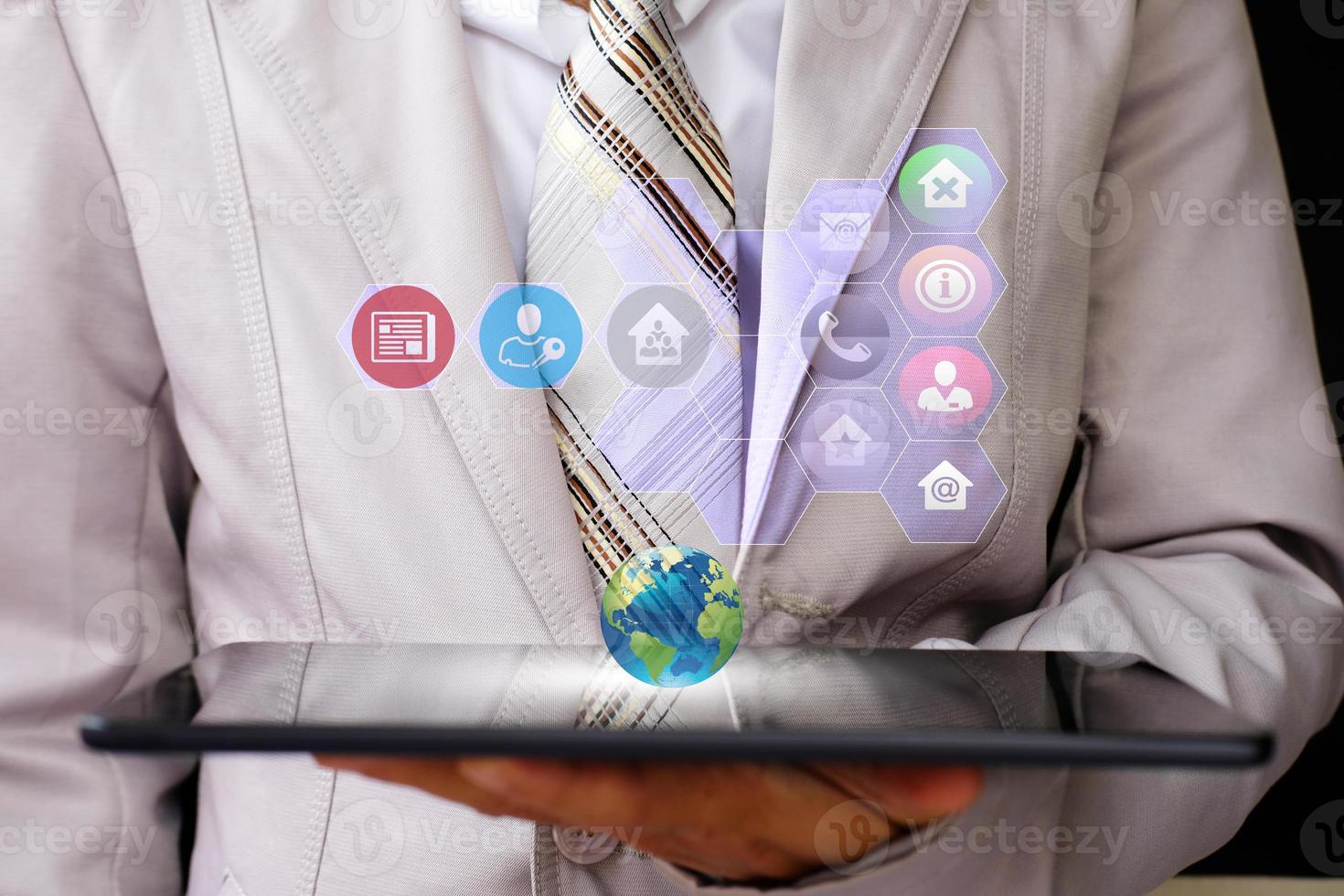 businessman holding tablet and technology network concepts photo