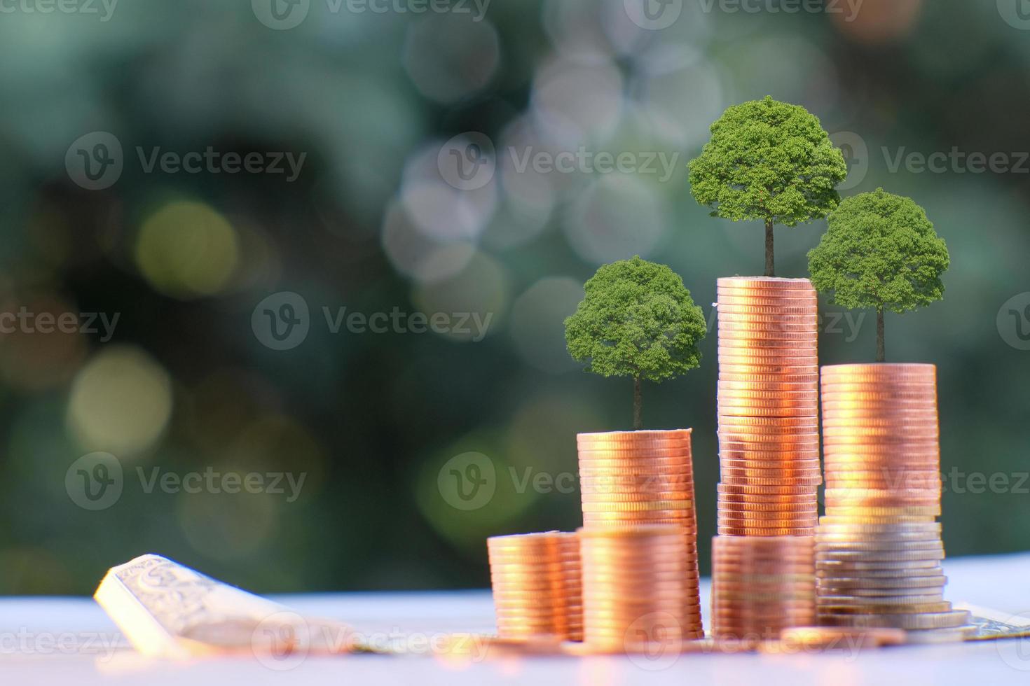 stack of coin on table background and saving money and business growth concept, finance and investment concept photo