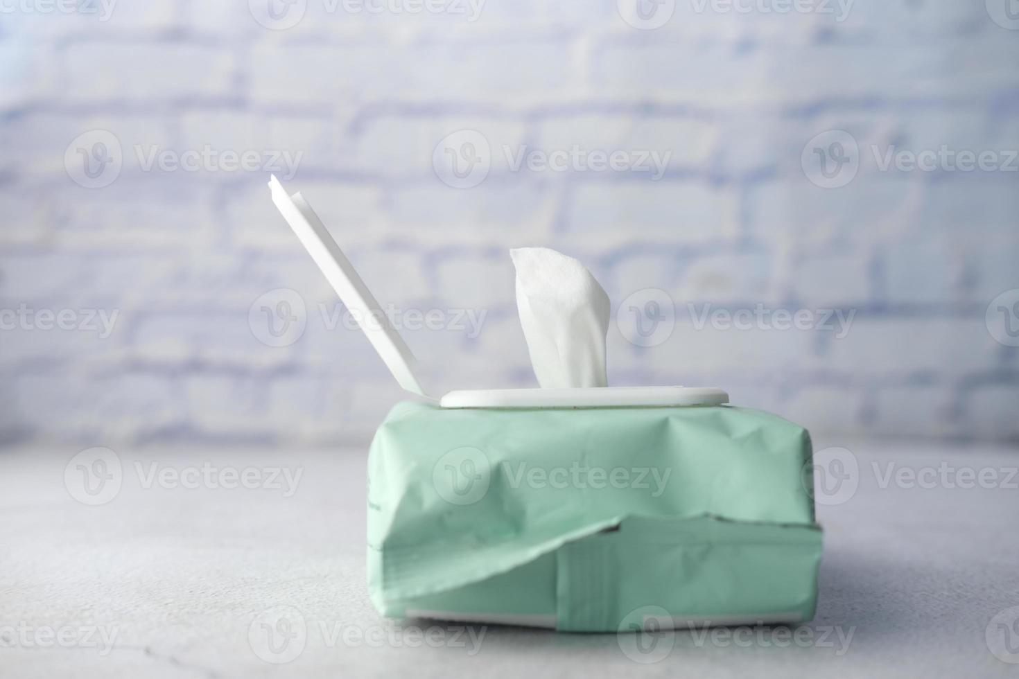 Cleansing wet wipes on table with copy space photo