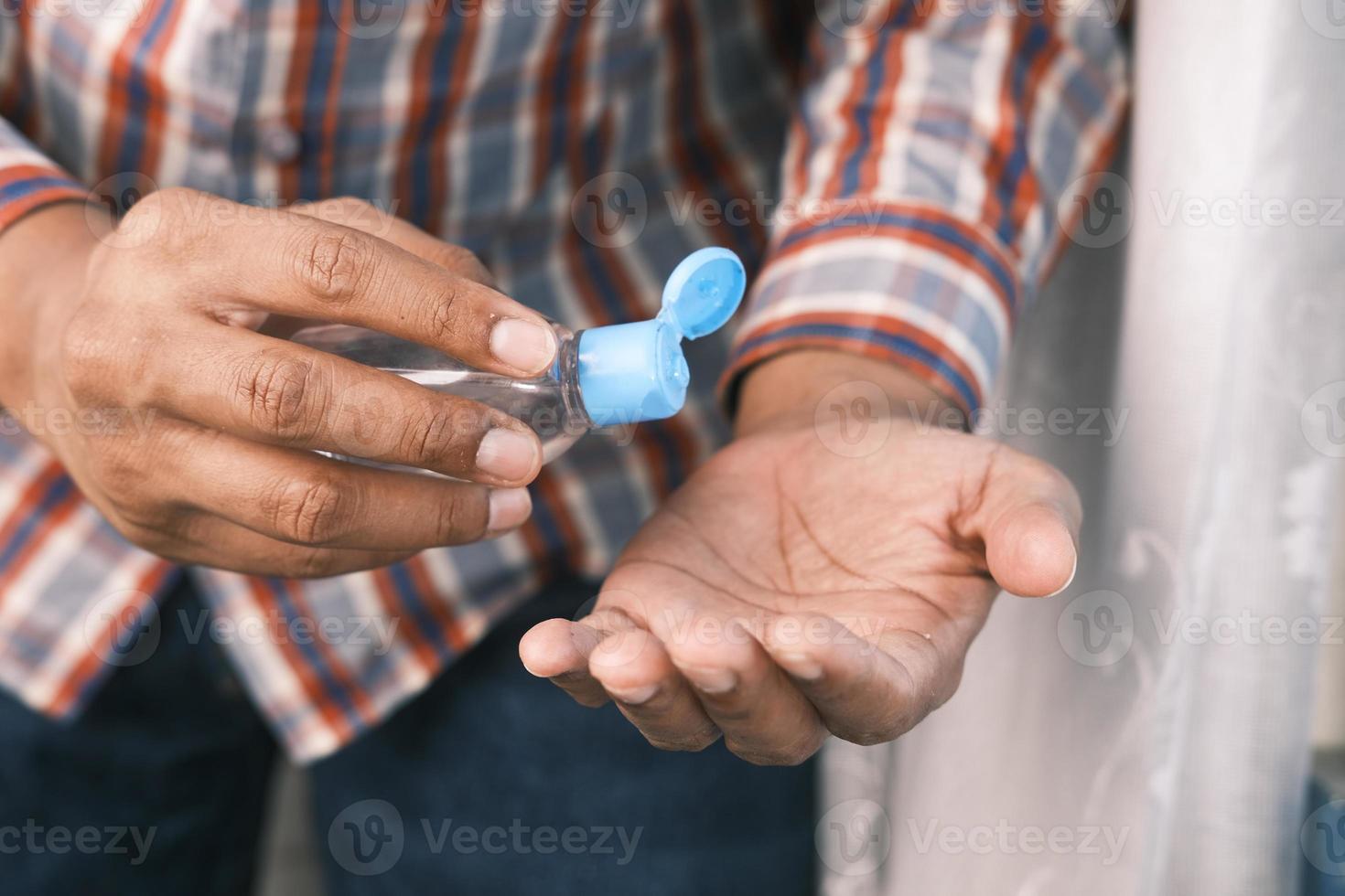 Using sanitizer liquid for preventing corona virus photo