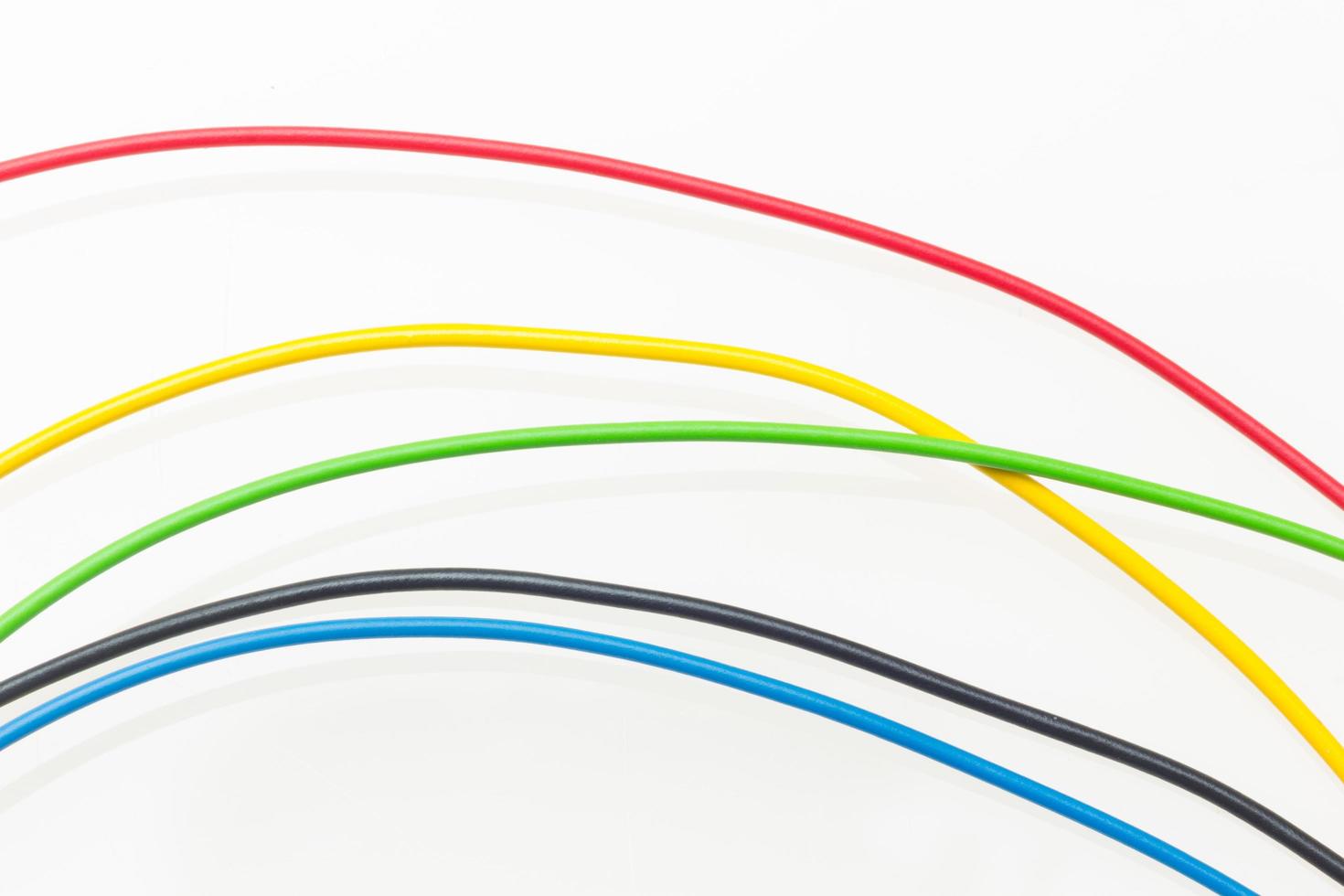 Colored wires on white background photo