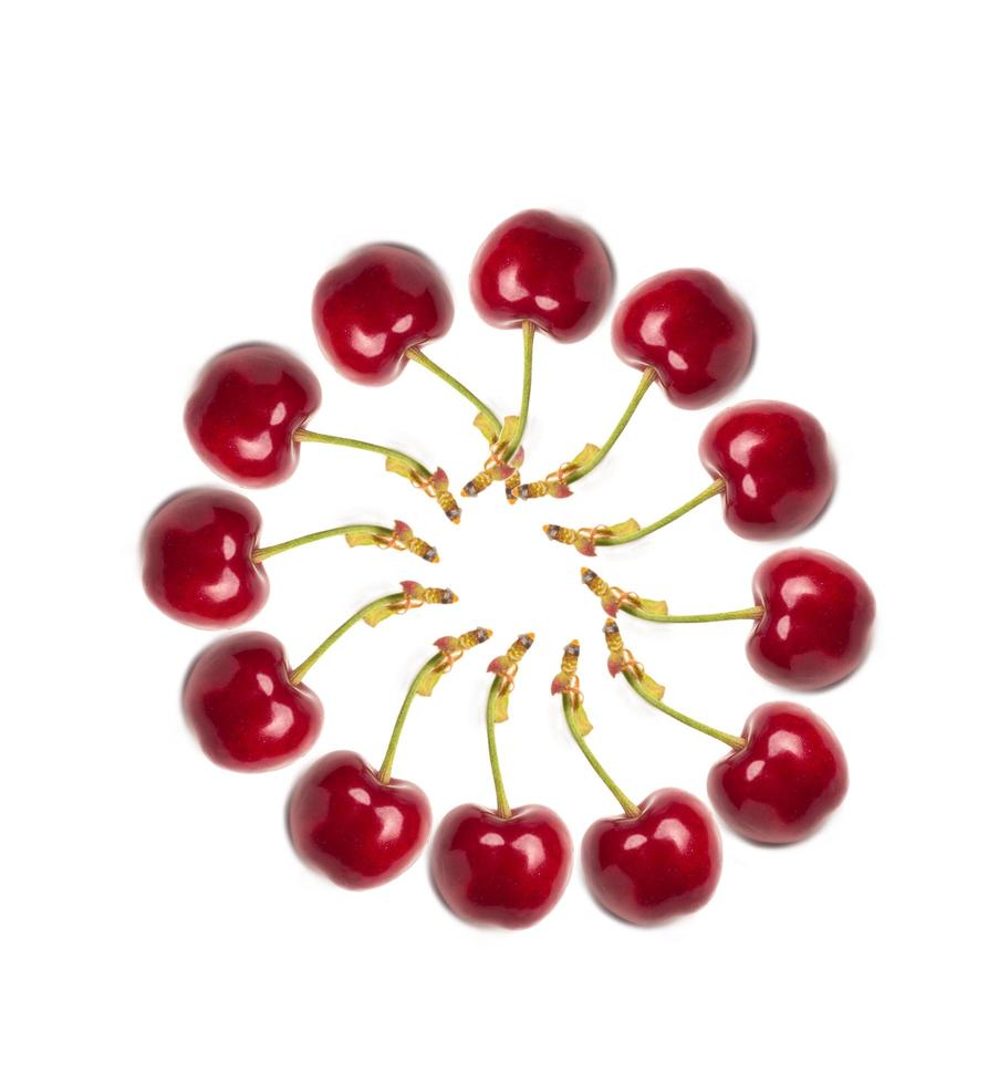 Small red cherries on a white background photo