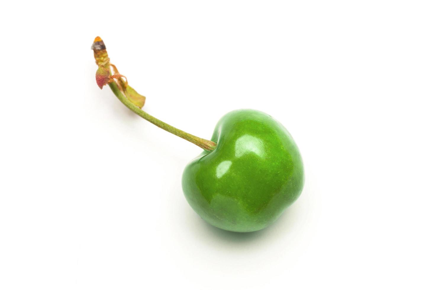 Small red cherries on a white background photo