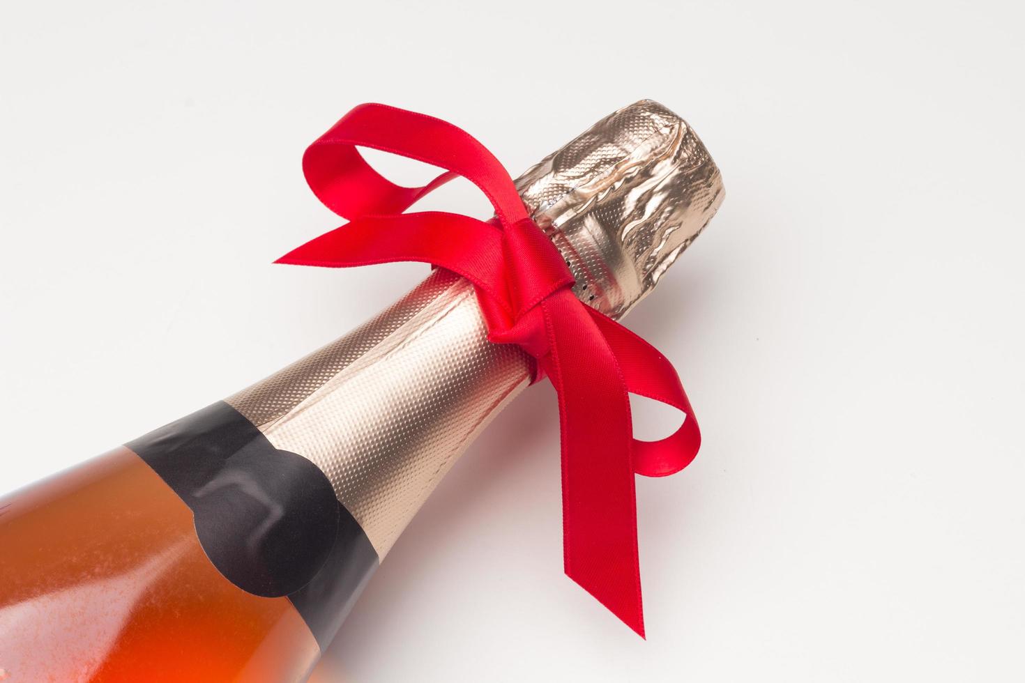 Campagne bottle with a red bow photo