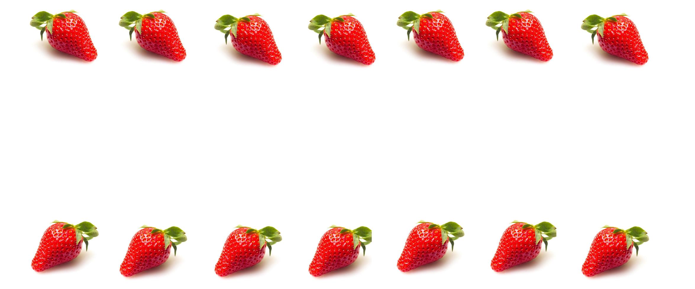 Two strawberries close up on white background photo