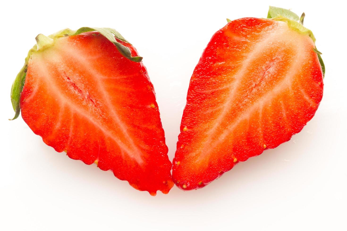 Two strawberries close up on white background photo