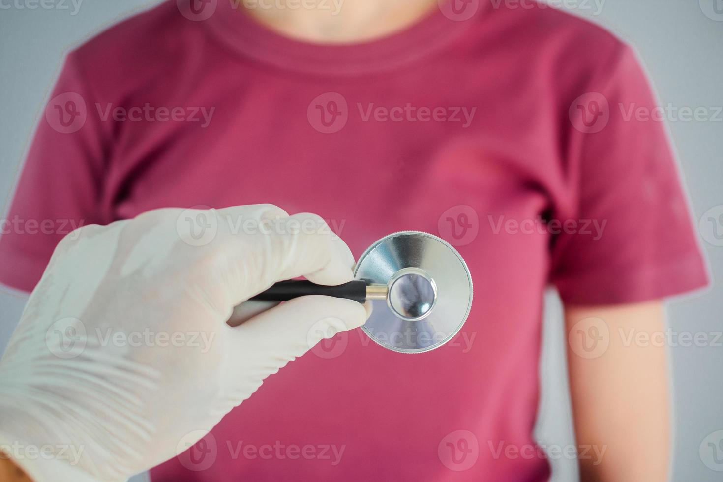 Doctor using stethoscope to check heart rate, heart disease , World heart day photo