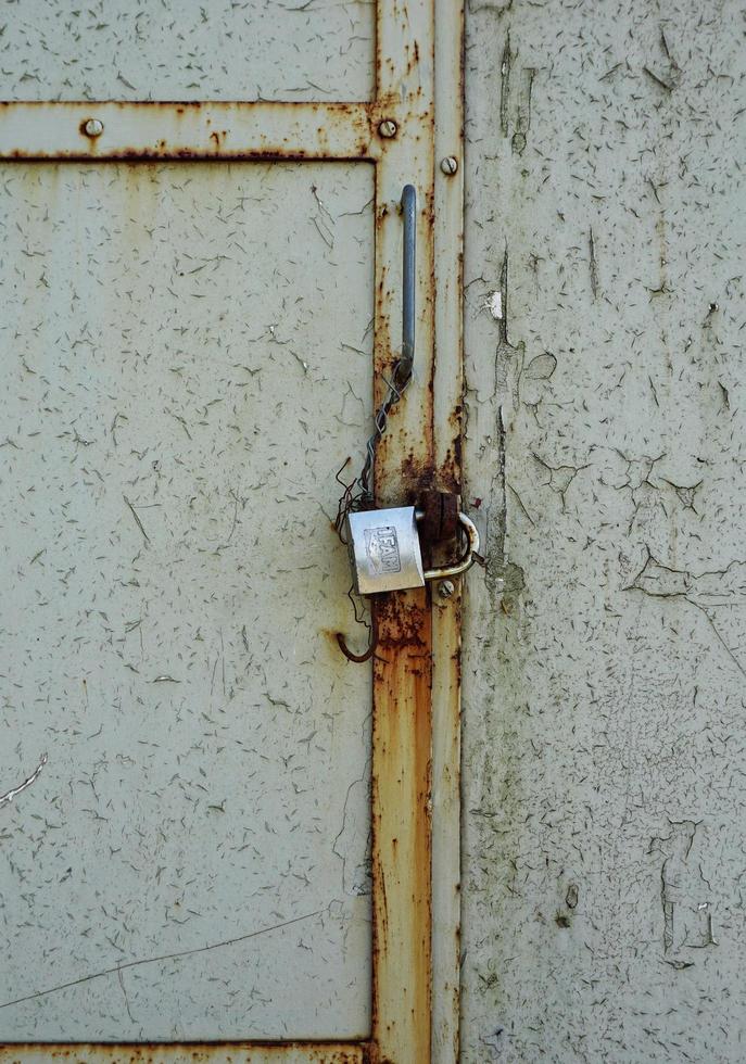 Old abandoned metallic door photo