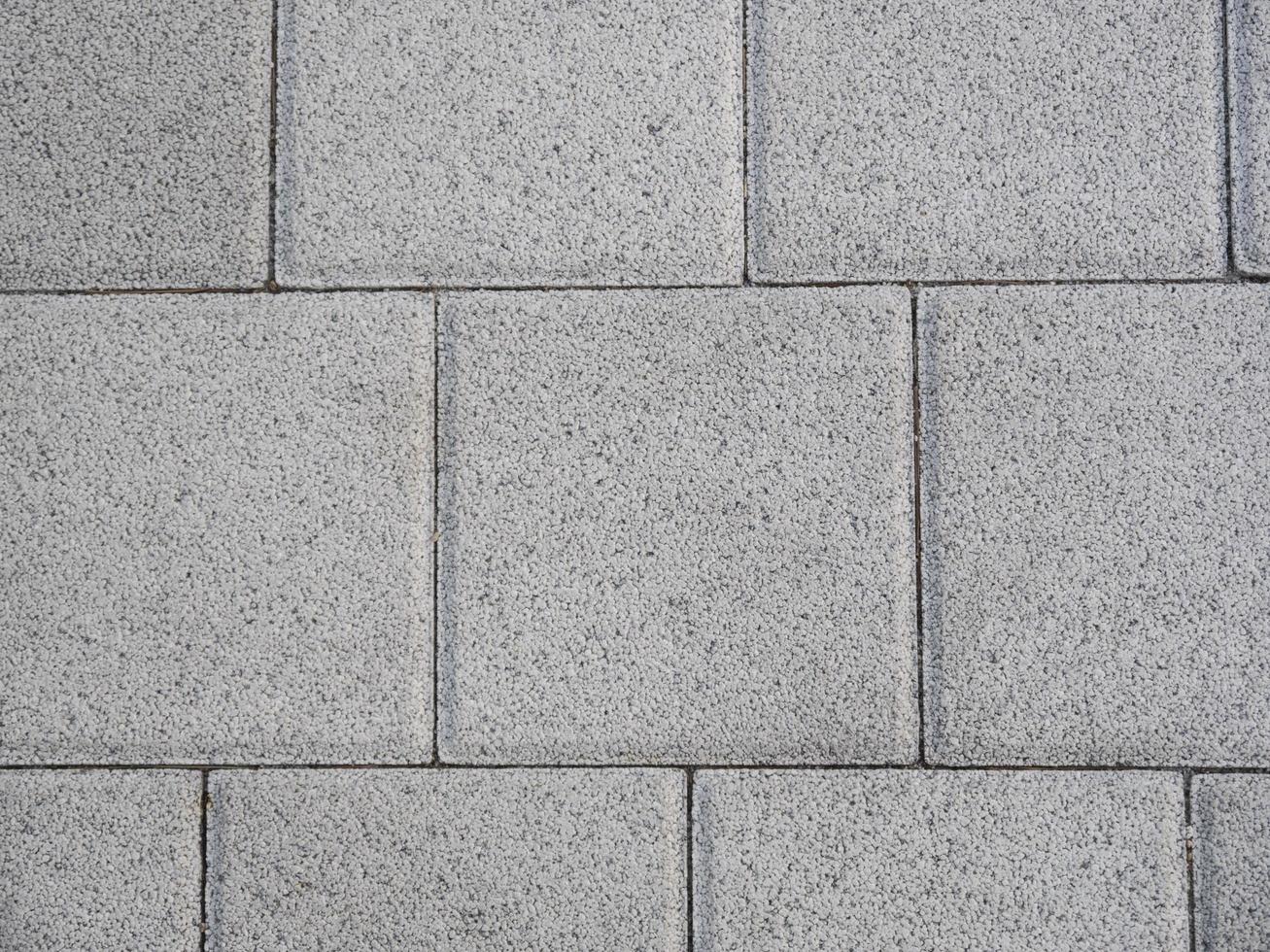 Beton tiles on the sidewalk as a texture photo