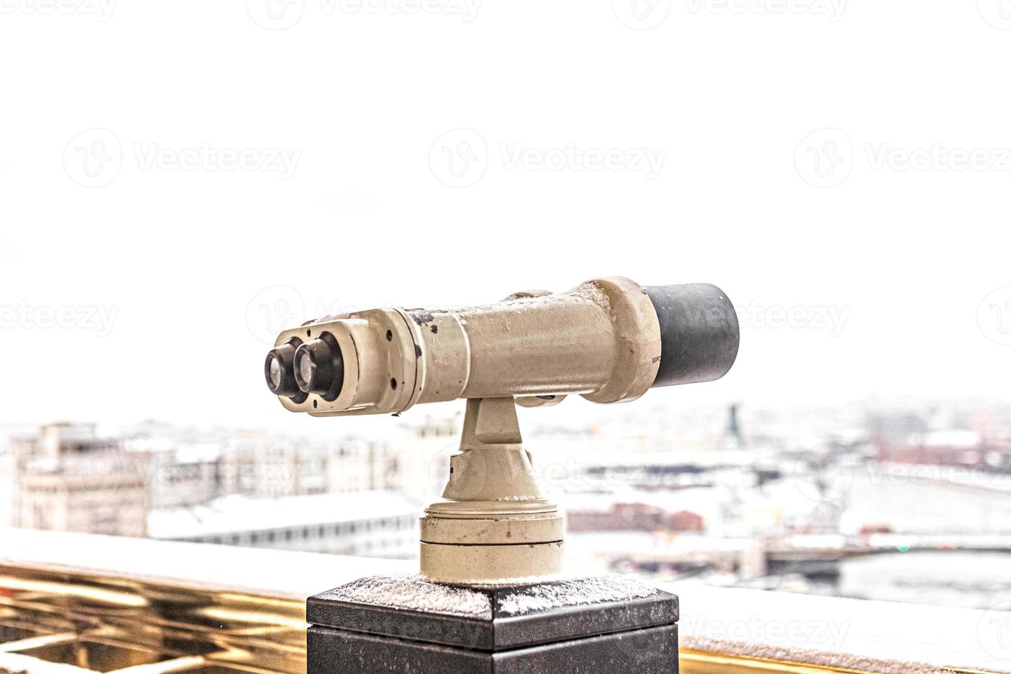 Coin-operated binoculars on the observation deck overlooking the city photo