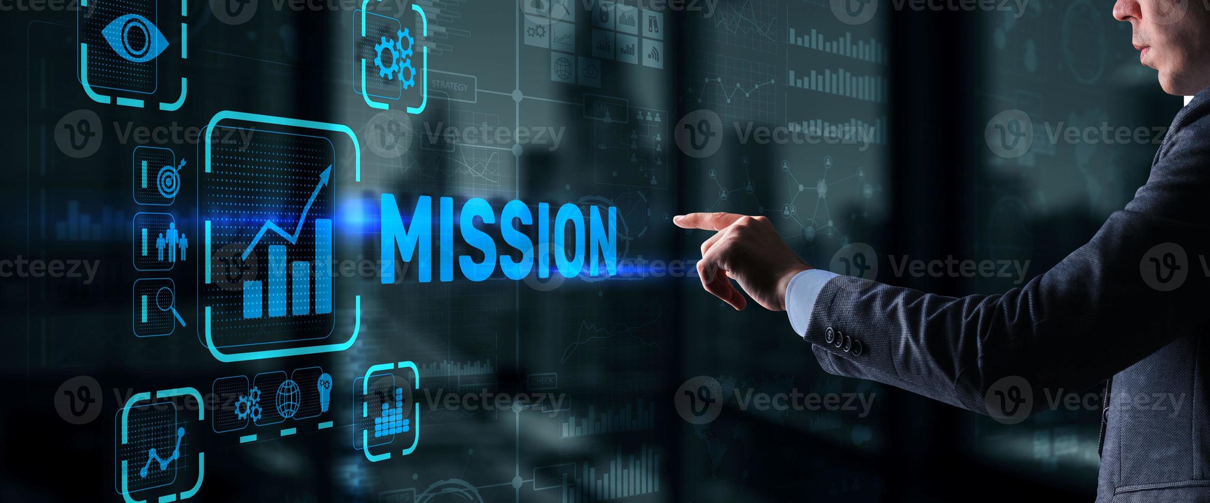 Businessman clicks on virtual screen Mission photo