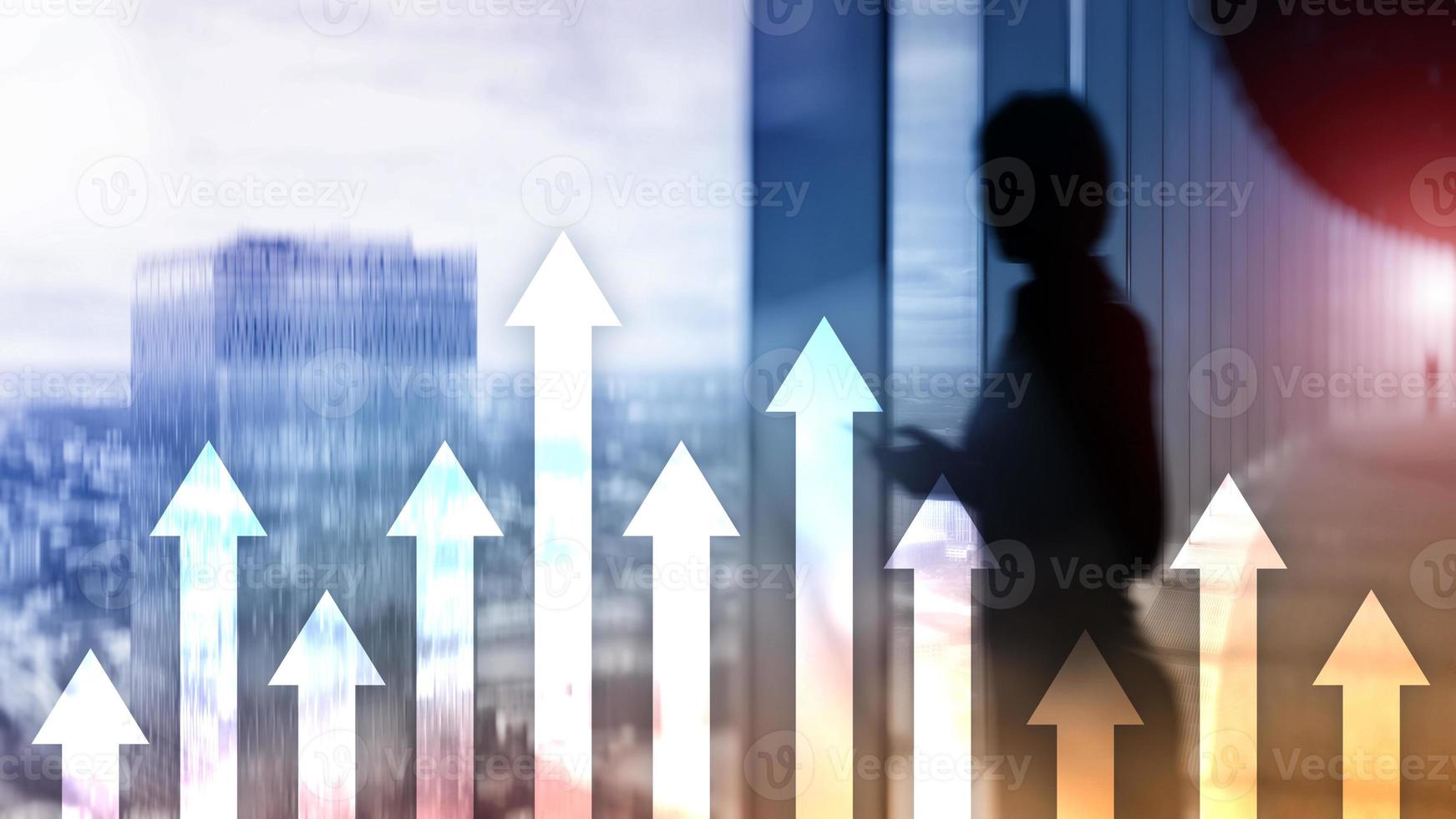 Up arrow graph on skyscraper background. Invesment and financial growth concept. photo