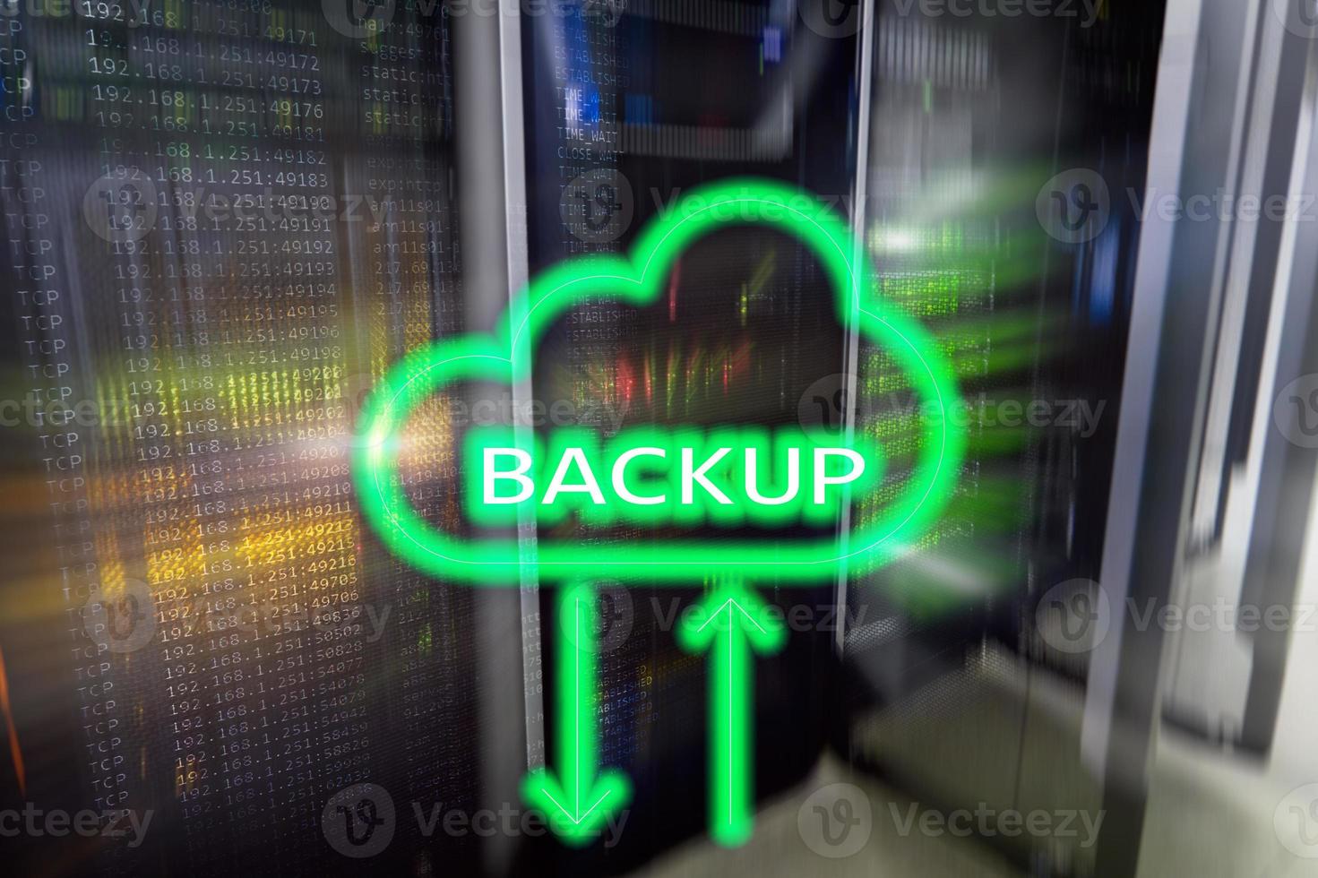 Backup button on modern server room background. Data loss prevention. System recovery. photo