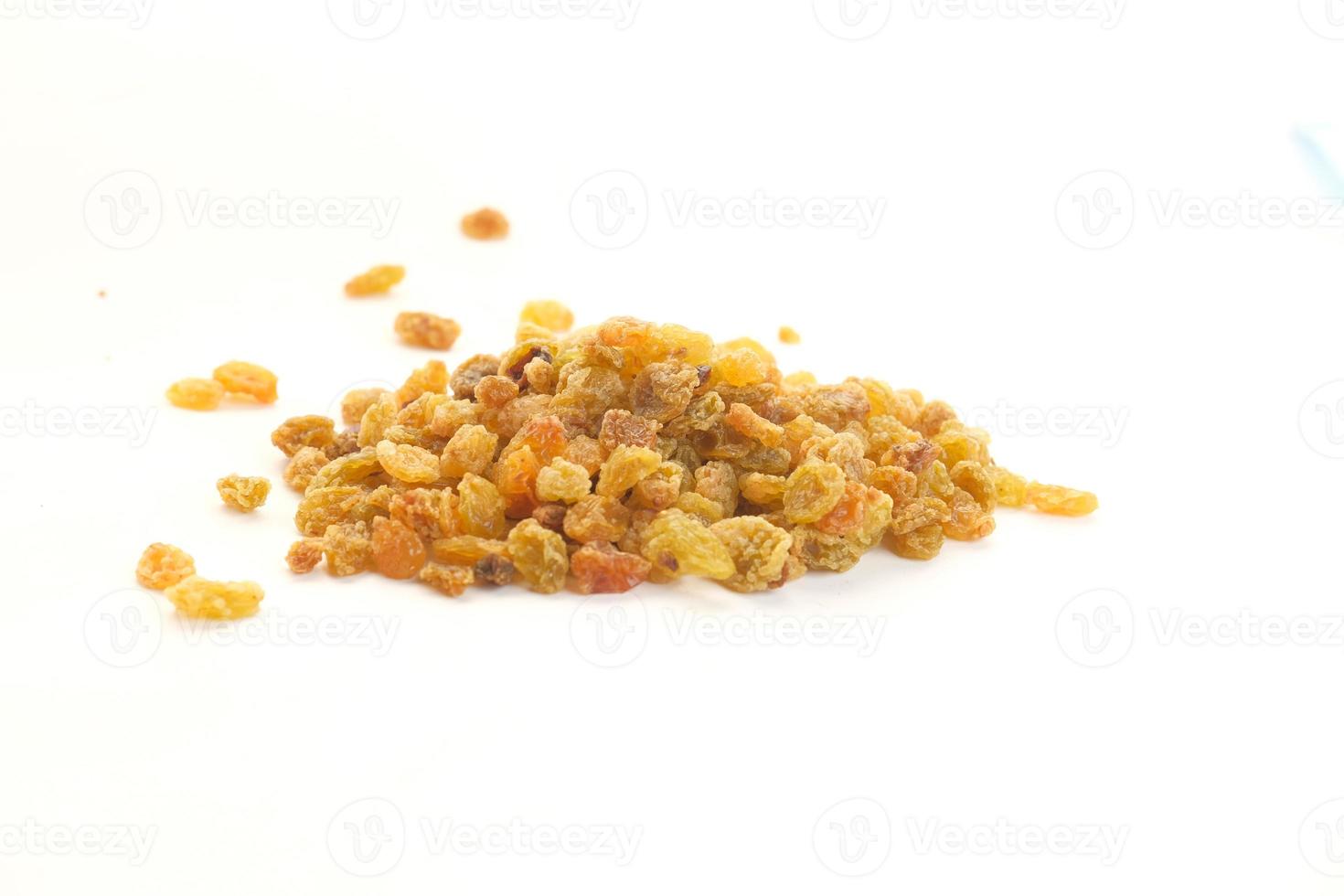 Dried raisins on white background with copy space photo