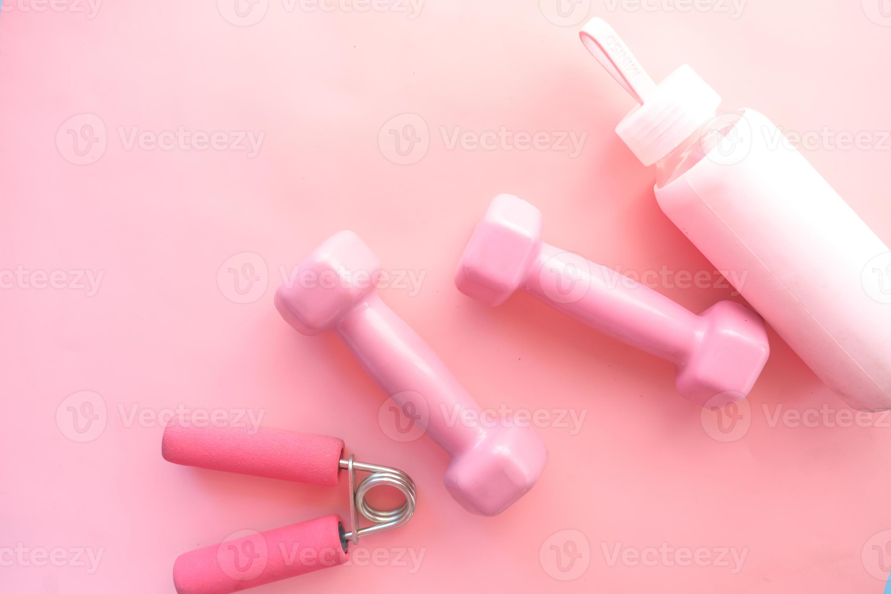 Pink color dumbbell, exercise mat and water bottle on white background  2751394 Stock Photo at Vecteezy