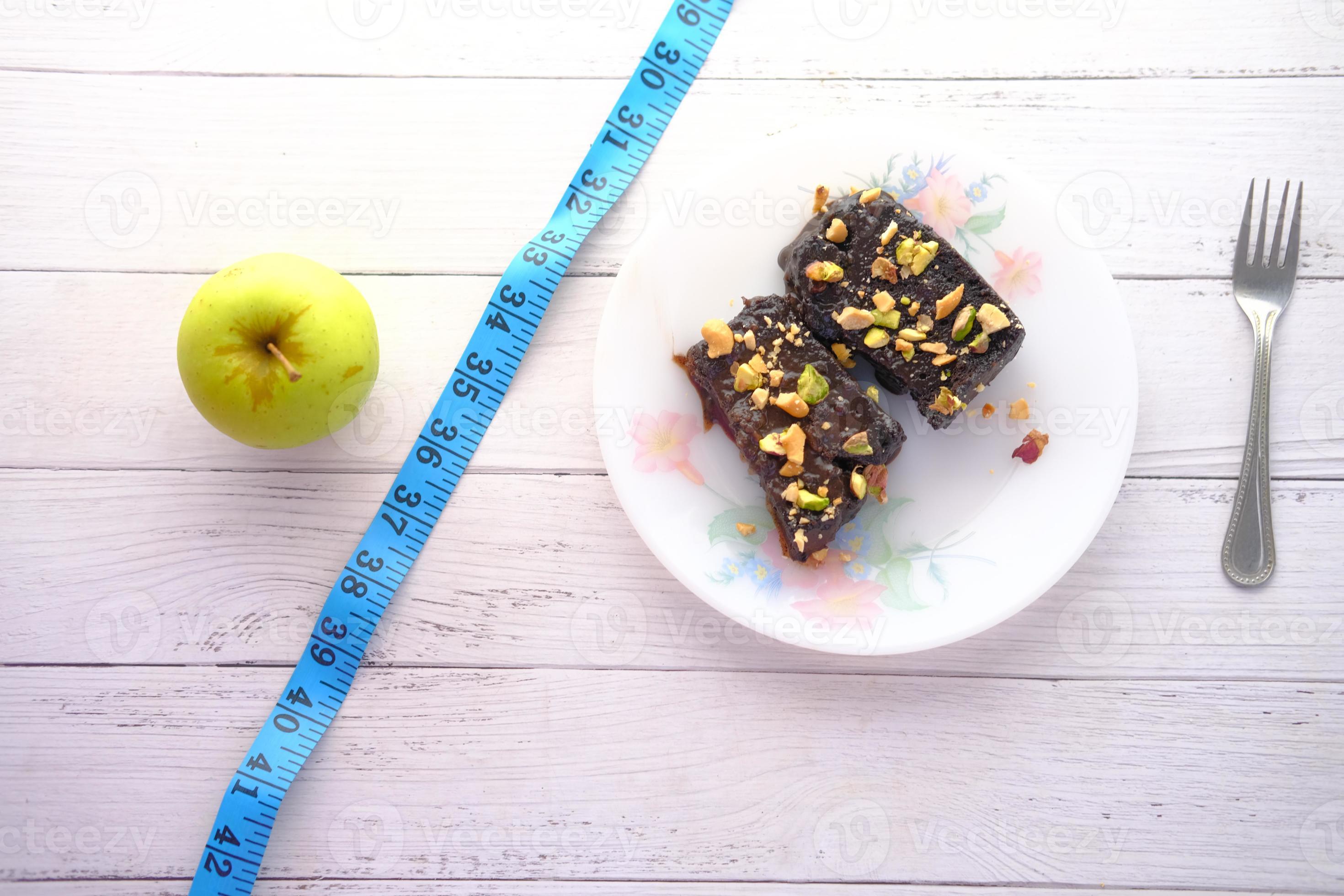 Comparing Apple And Brownie Healthy Diet Concept 2751680 Stock Photo At Vecteezy