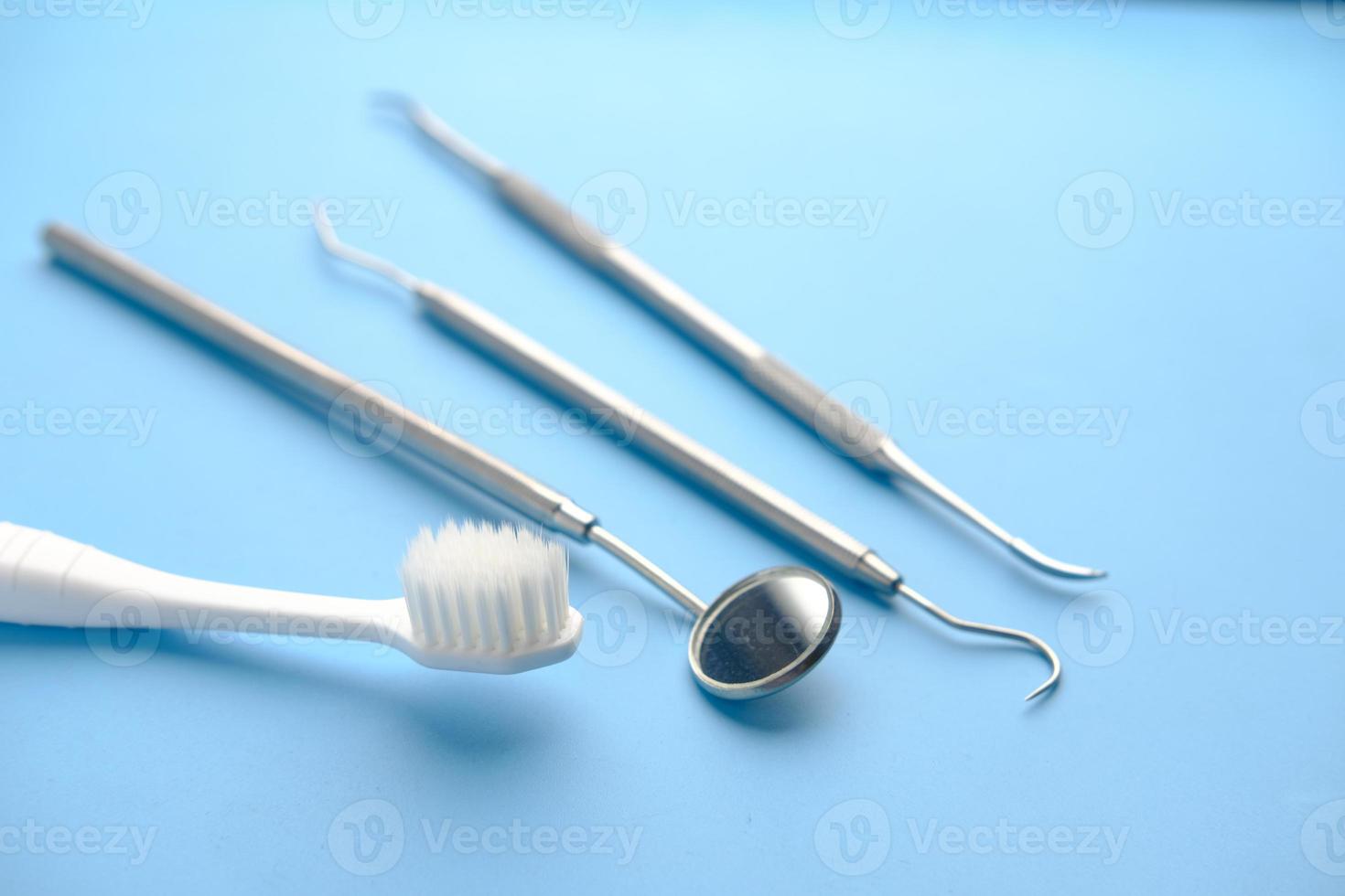 Dental equipment and a toothbrush on table photo