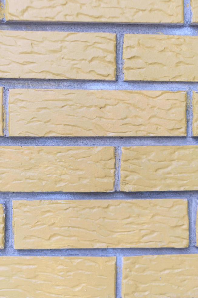 Yellow grunge brick wall photo