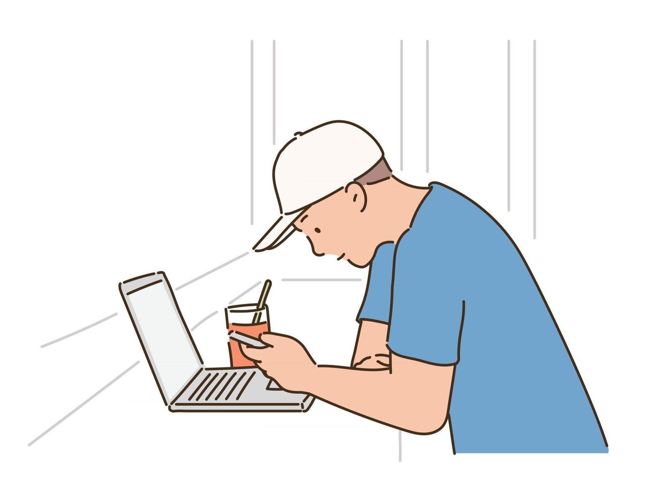 A man in a white hat is looking at his phone with his laptop open in a cafe. vector