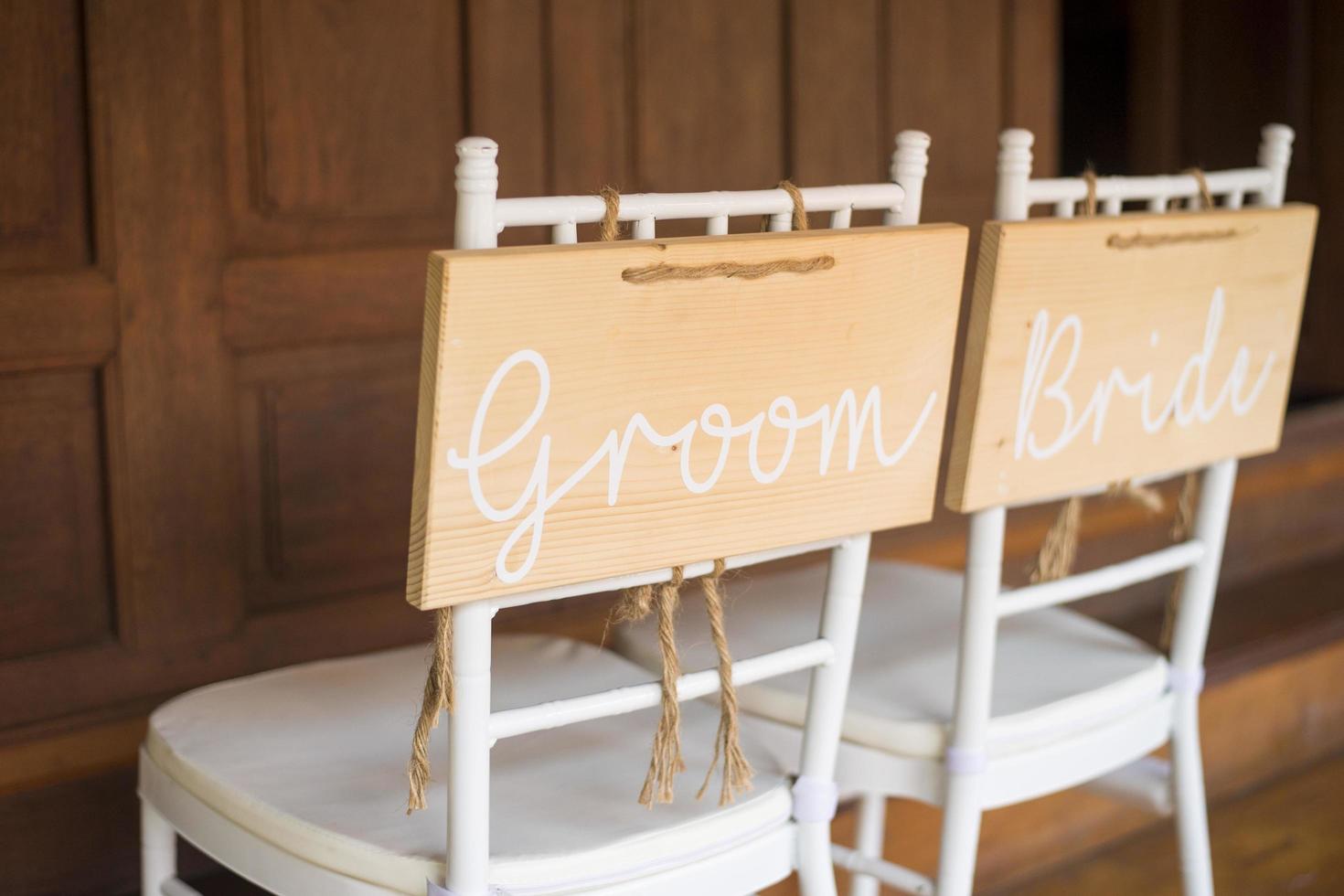 White wedding chair bride and groom photo