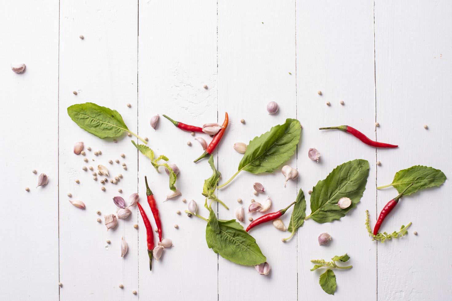 Ingredient of spices vegetables on white wood table photo