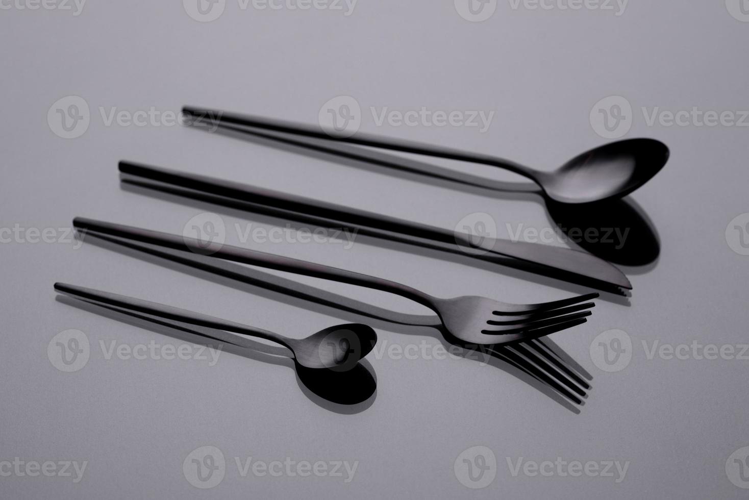 Cutlery on a gray background with shadow. Table serving photo