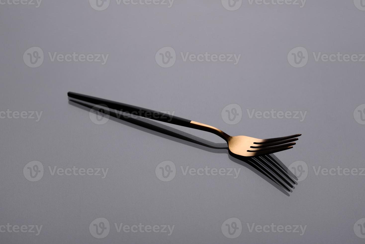 Cutlery on a gray background with shadow. Table serving photo