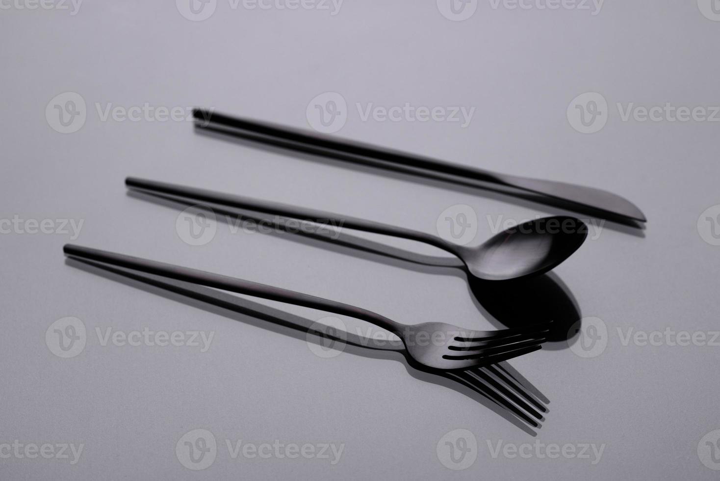 Cutlery on a gray background with shadow. Table serving photo