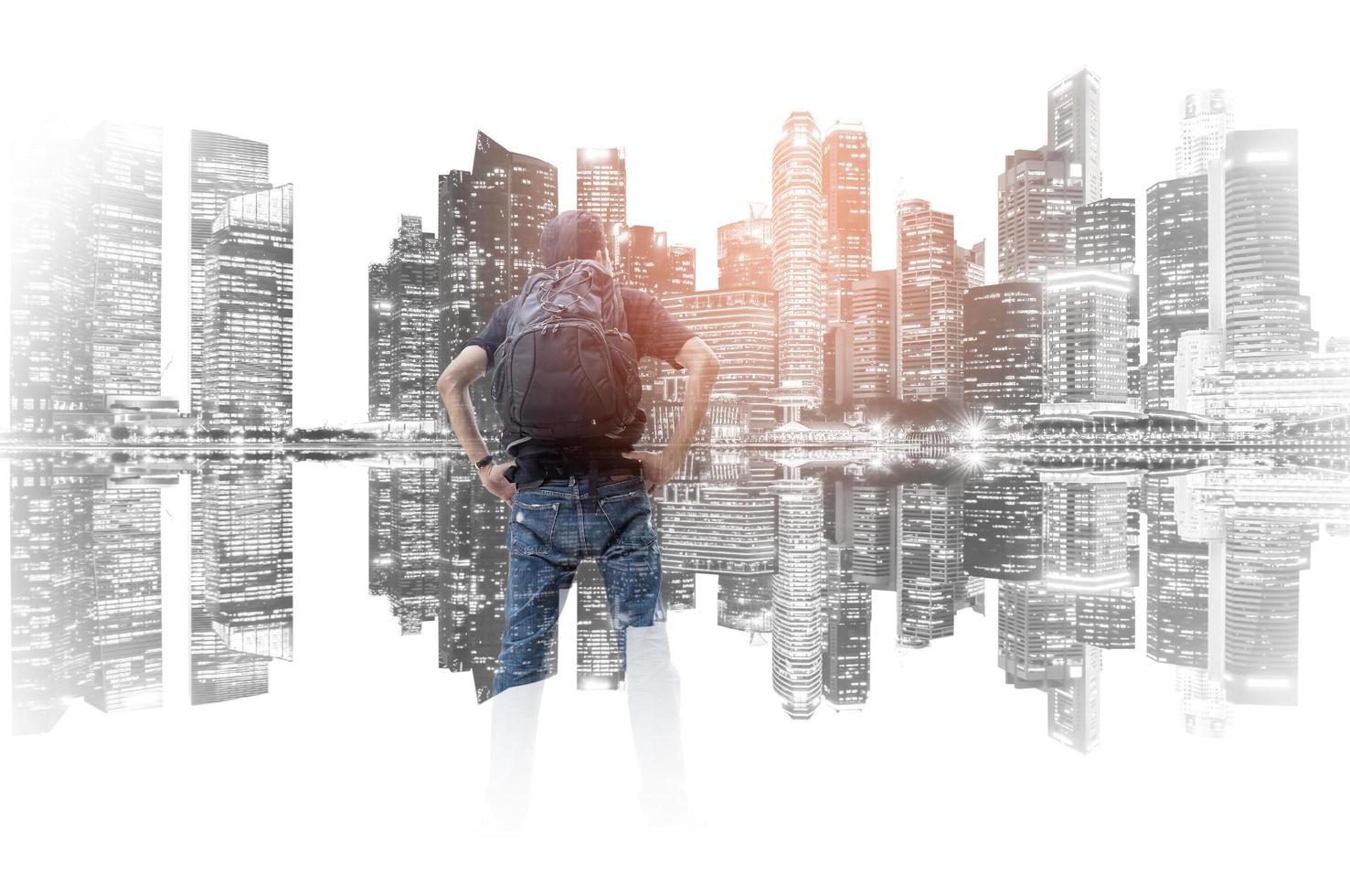 Double exposure of backpacker with the cityscape background photo