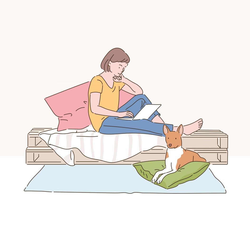 una mujer está leyendo un libro en su cama y un perro está sentado debajo de él. ilustraciones de diseño de vectores de estilo dibujado a mano.