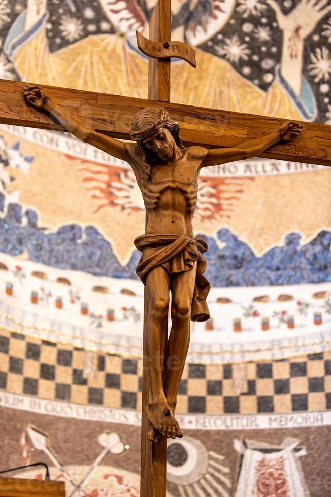 Wooden crucifix with hand carved Jesus photo
