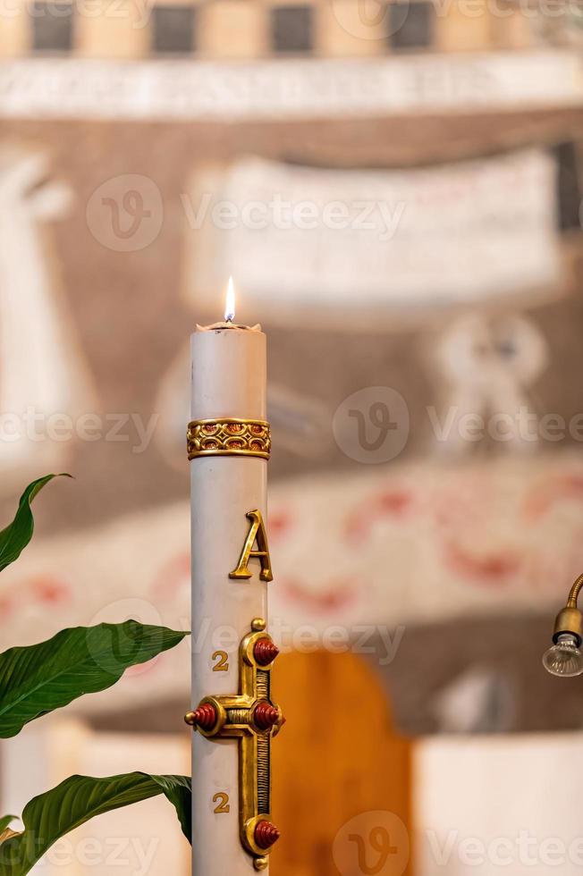 Large candle lit for a ceremony photo