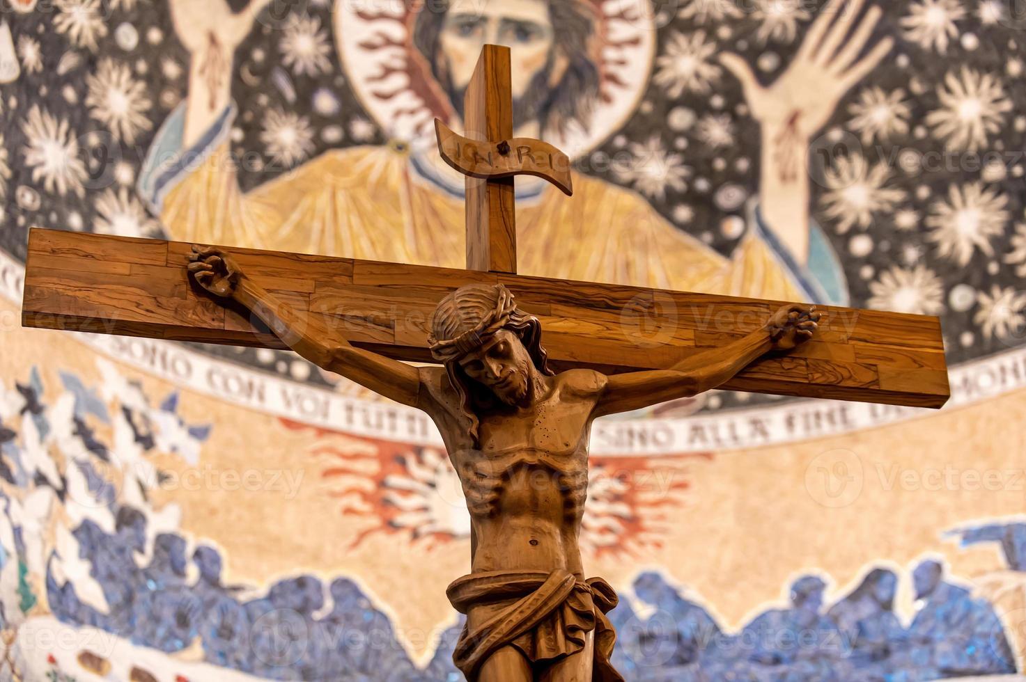 Wooden crucifix with hand carved Jesus photo