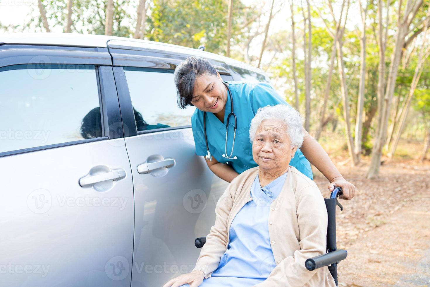 Doctor help and care Asian senior or elderly old lady woman patient sitting on wheelchair at nursing hospital ward healthy strong medical concept photo