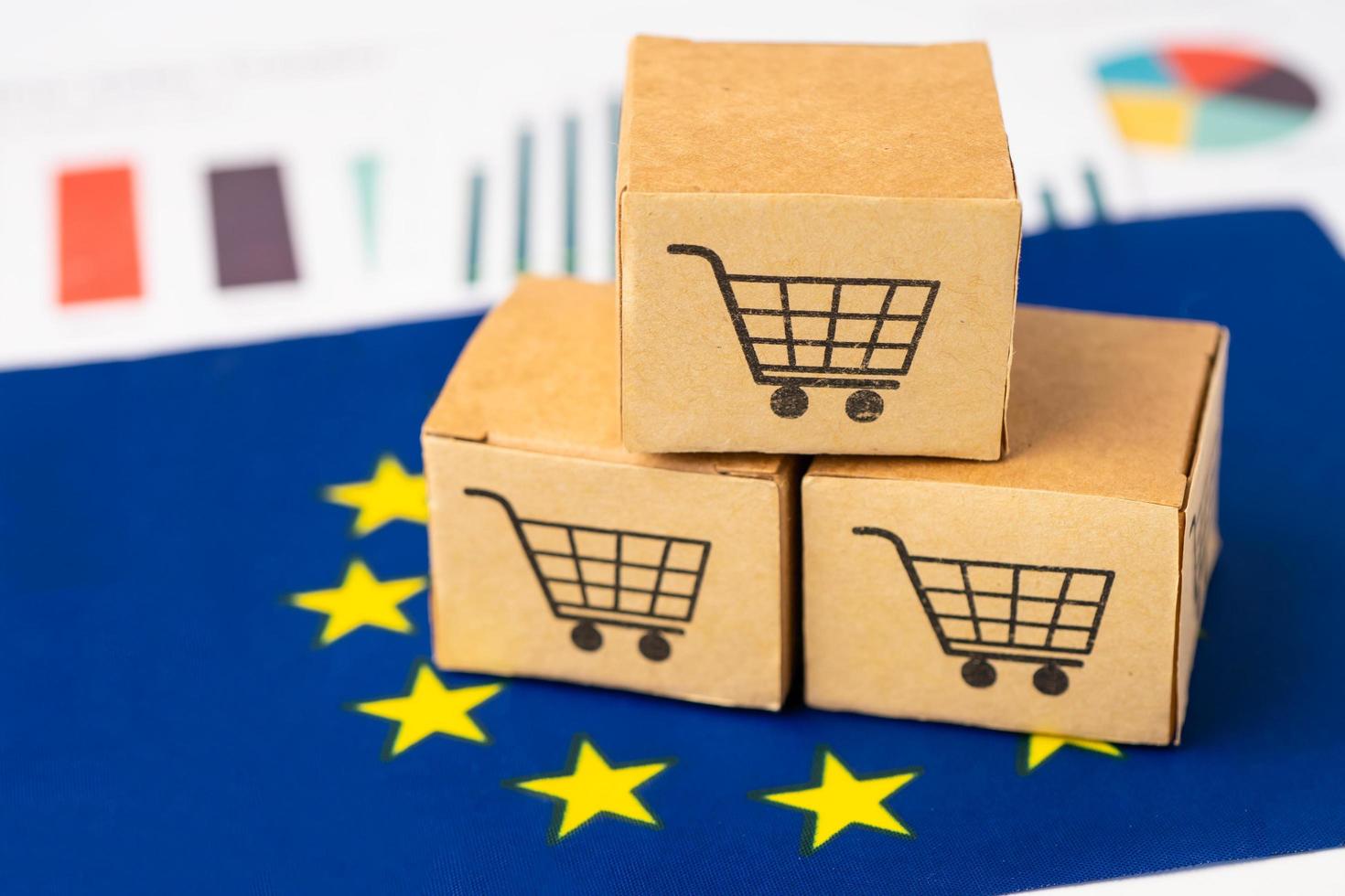 Box with shopping cart logo and EU flag, Import Export Shopping online or eCommerce finance delivery service store product shipping, trade, supplier concept. photo