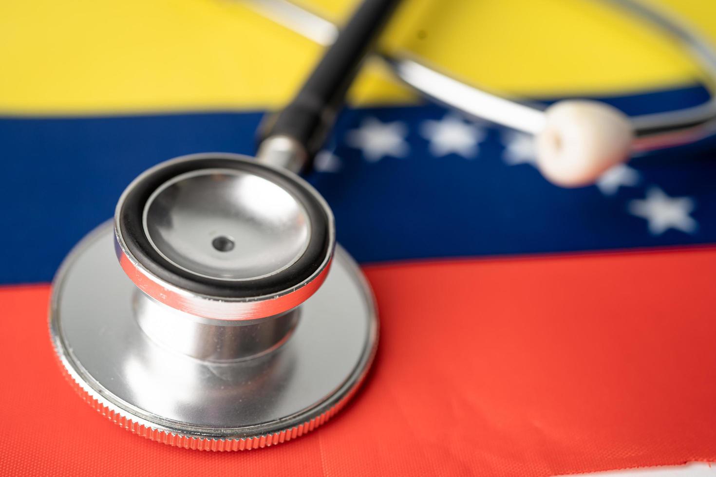 Black stethoscope on Venezuela flag background, Business and finance concept. photo