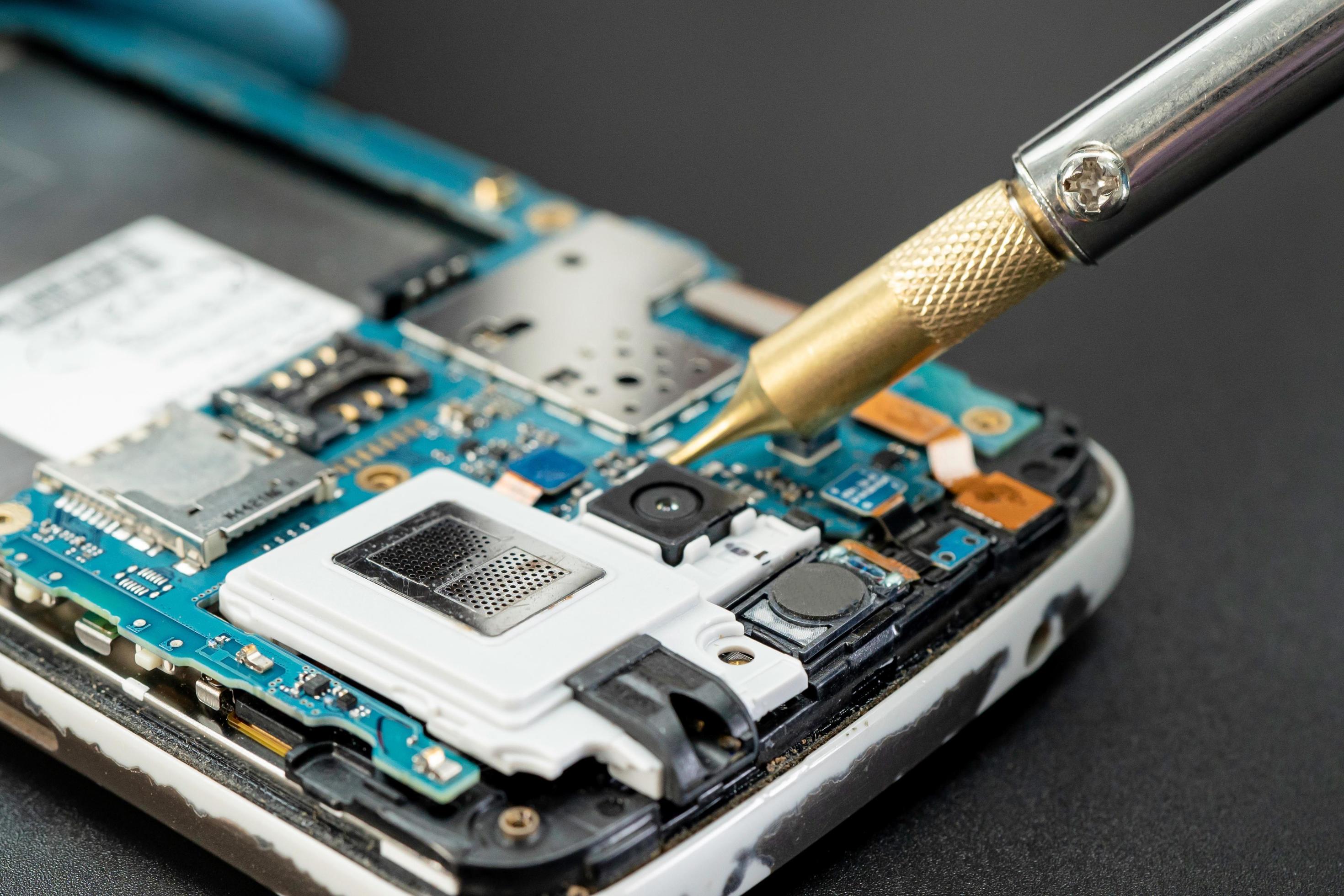 Technician repairing inside of mobile phone by soldering iron. Integrated Circuit. the concept of data, hardware, technology. 2761014 Stock Photo at Vecteezy Technician repairing inside of mobile phone by soldering iron. Integrated Circuit. the concept of data, hardware, technology. 2761014 Stock Photo at Vecteezy